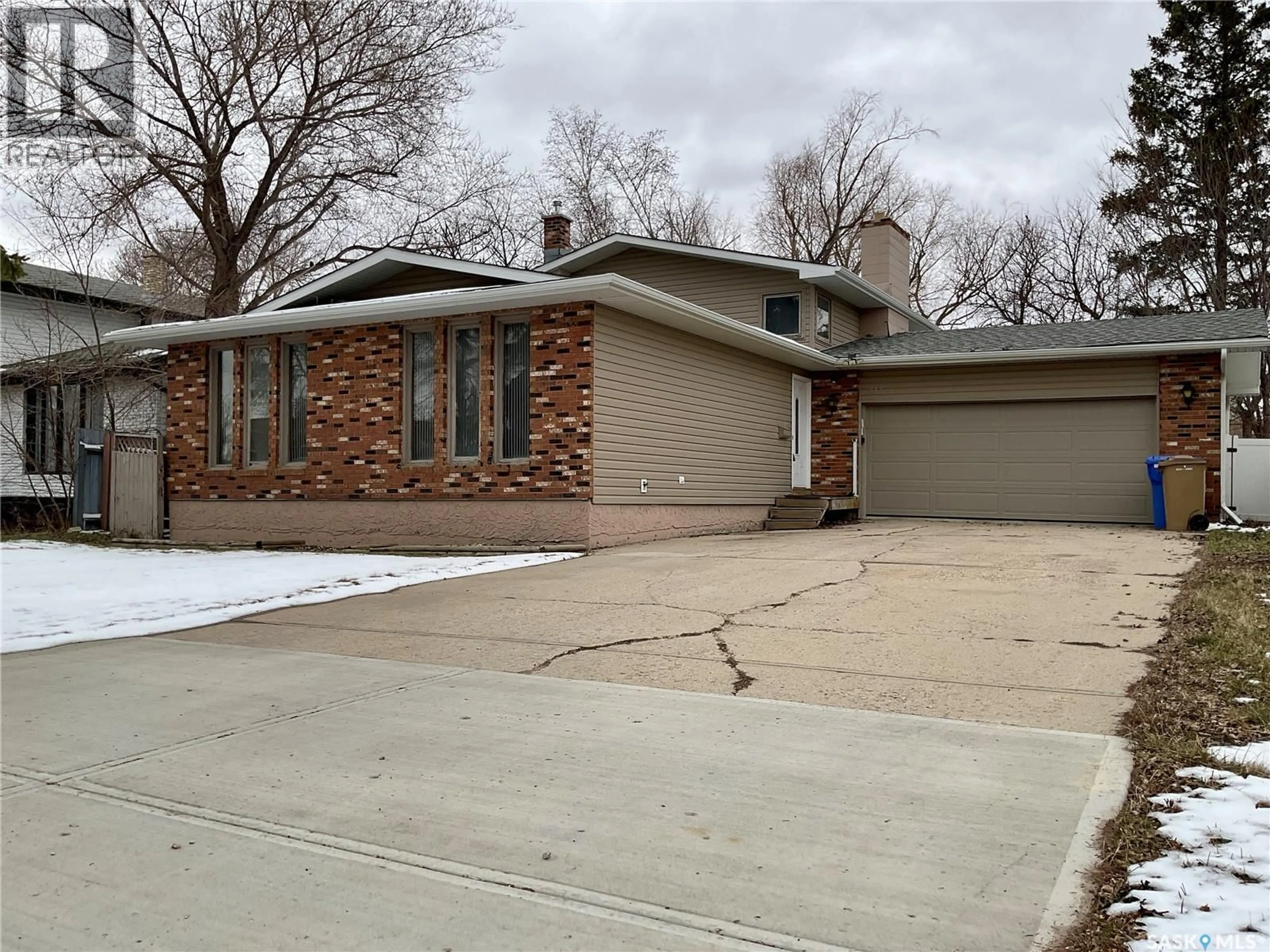 Home with brick exterior material, street for 114 WINDFIELD ROAD, Regina Saskatchewan S4V0K2