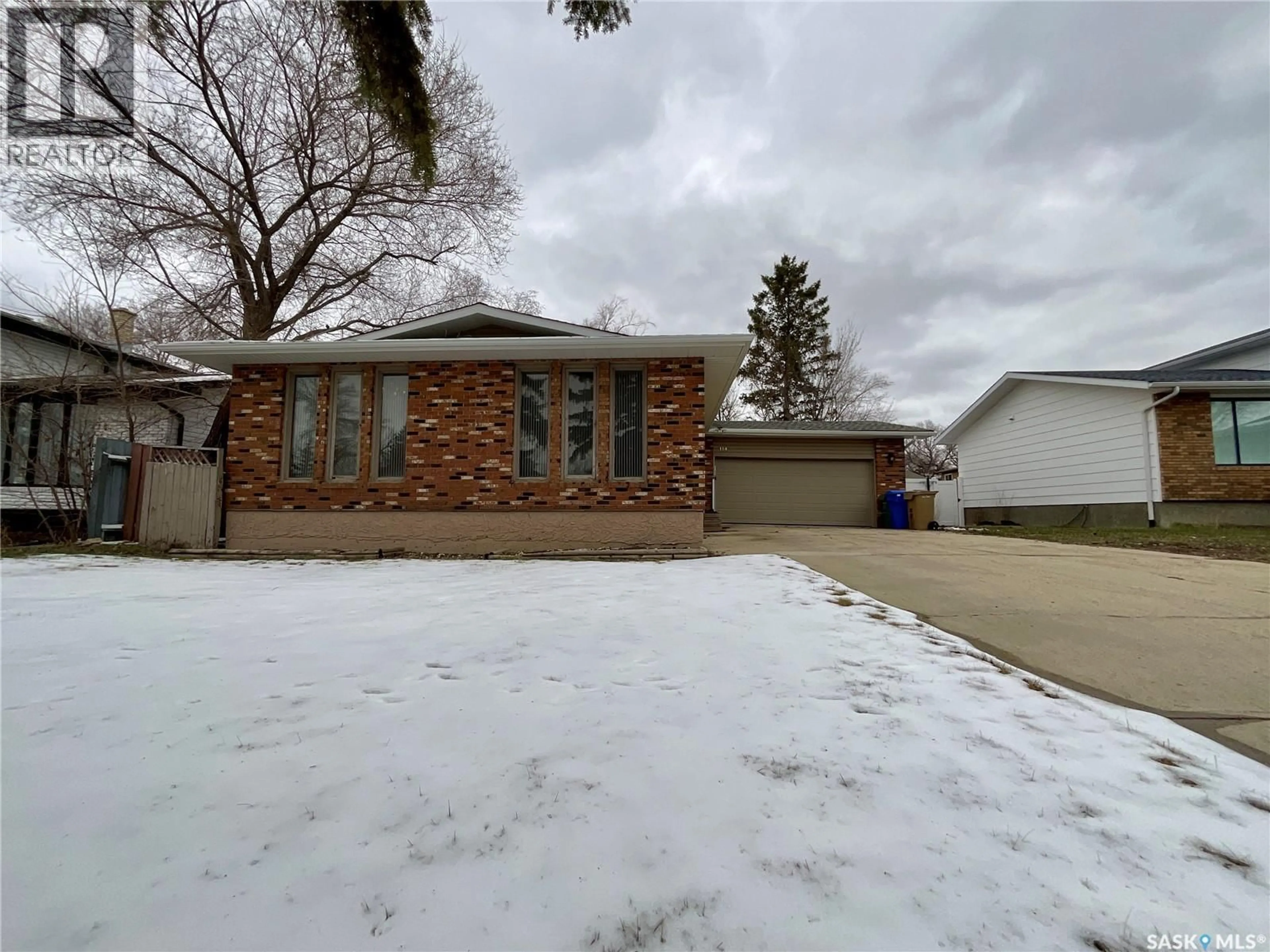 Home with brick exterior material, street for 114 WINDFIELD ROAD, Regina Saskatchewan S4V0K2