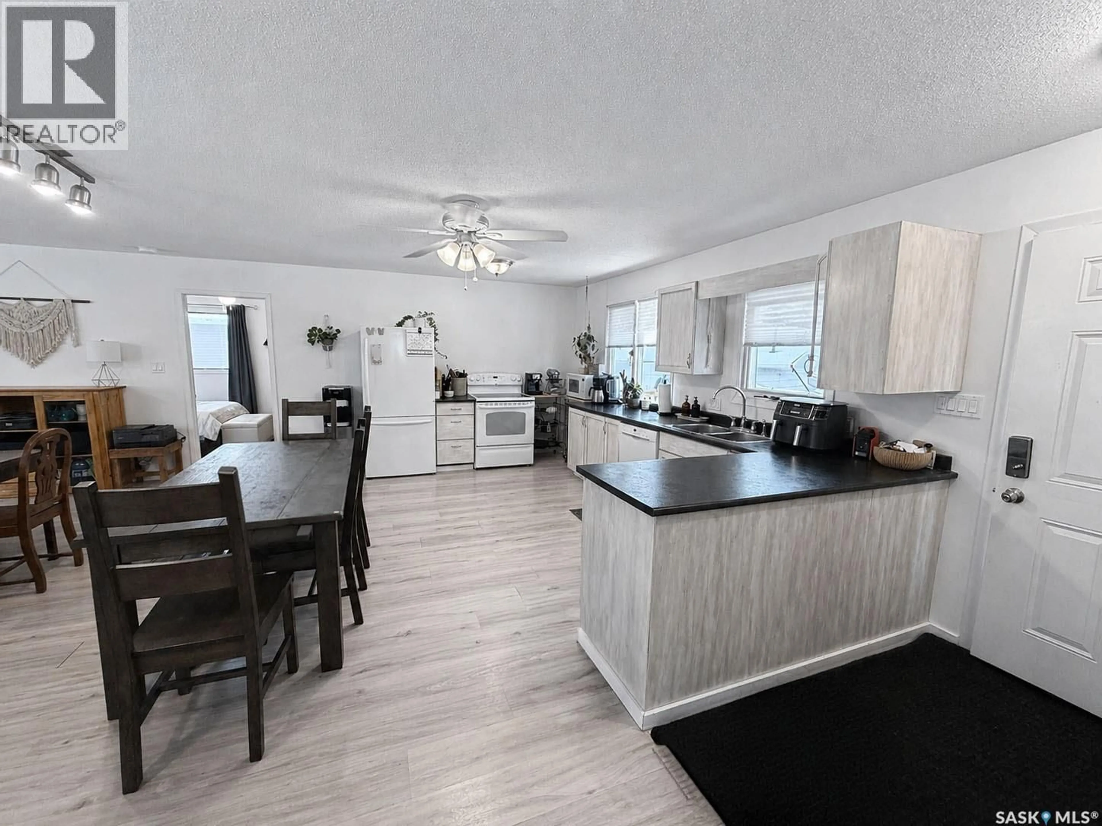 Open concept kitchen, wood/laminate floor for 505 MARINE DRIVE, Lakeland Rm No. 521 Saskatchewan S0J0N0