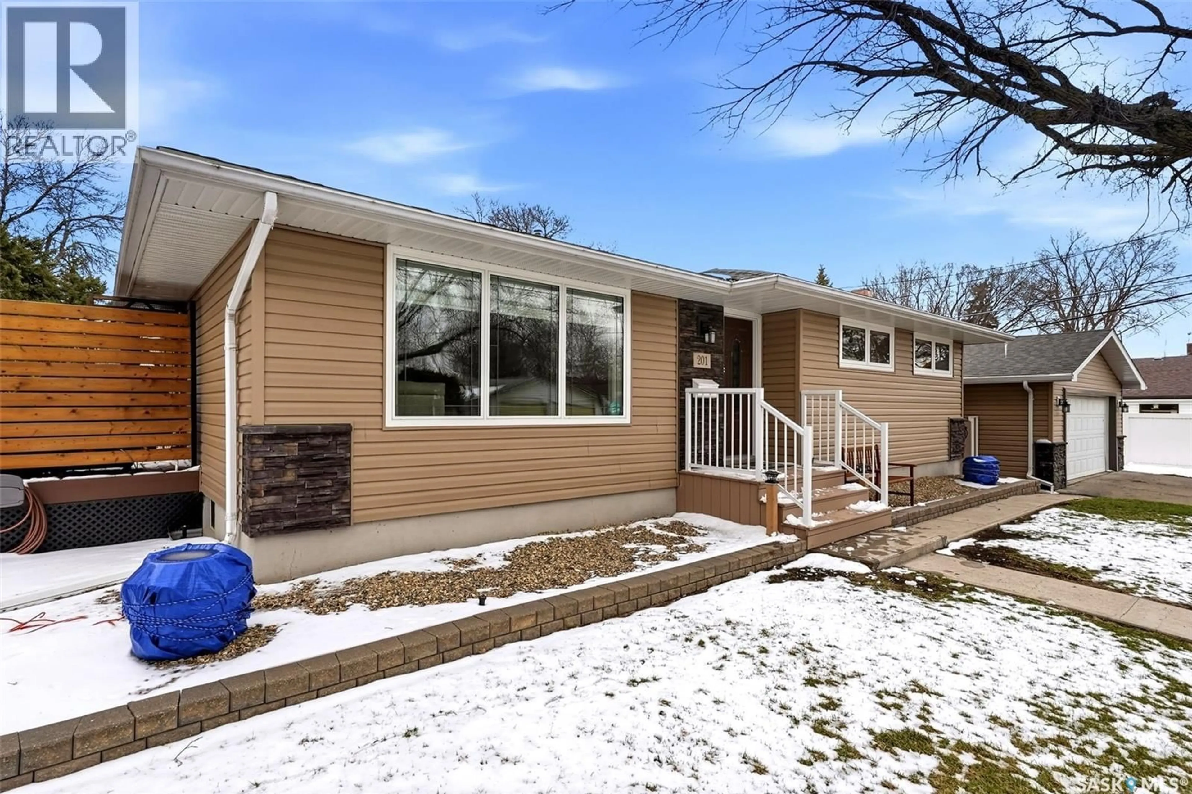 Home with vinyl exterior material, street for 201 SHANNON ROAD, Regina Saskatchewan S4S5H8