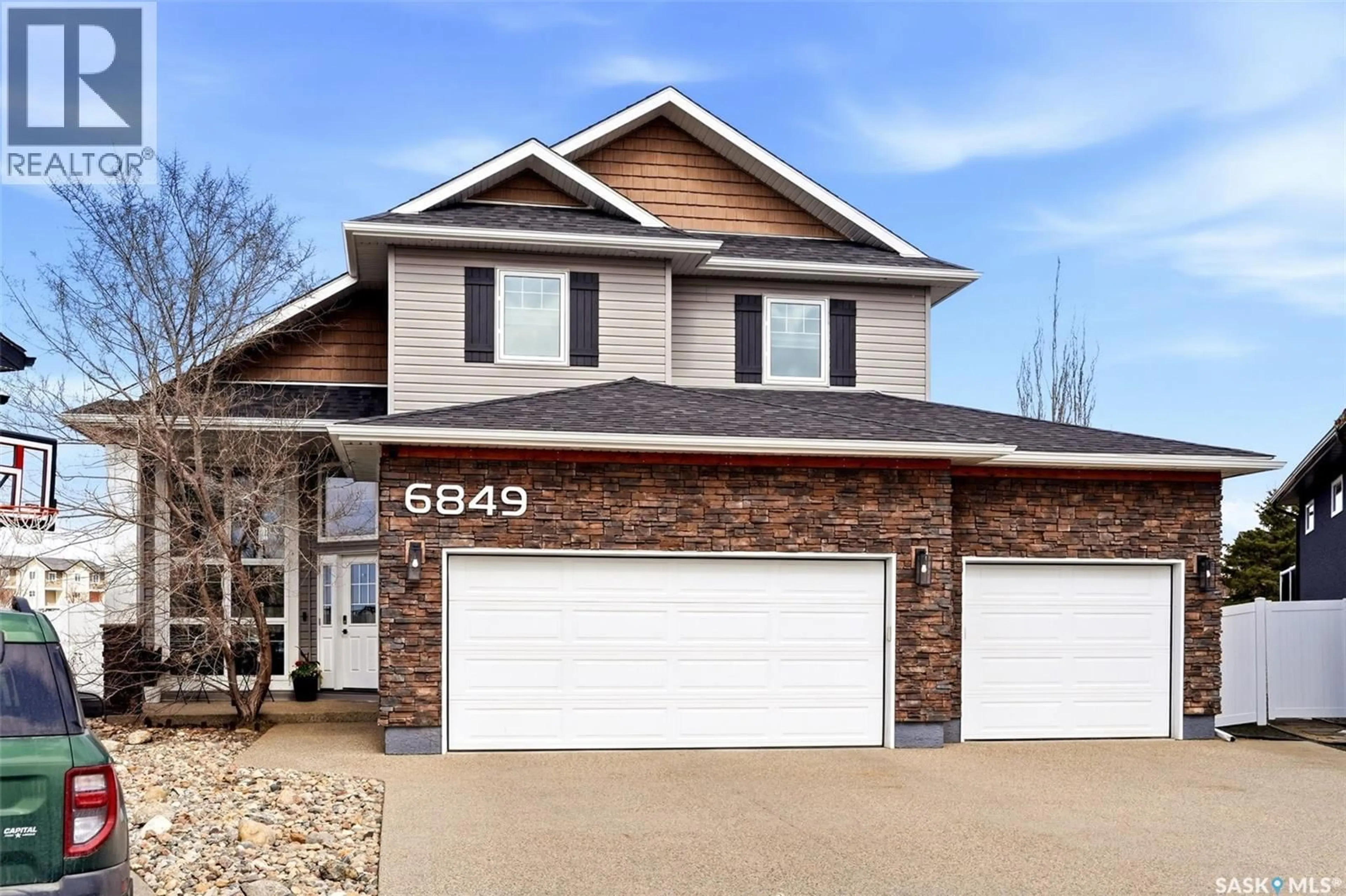 Home with brick exterior material, street for 6849 MAPLE VISTA DRIVE, Regina Saskatchewan S4X0J7