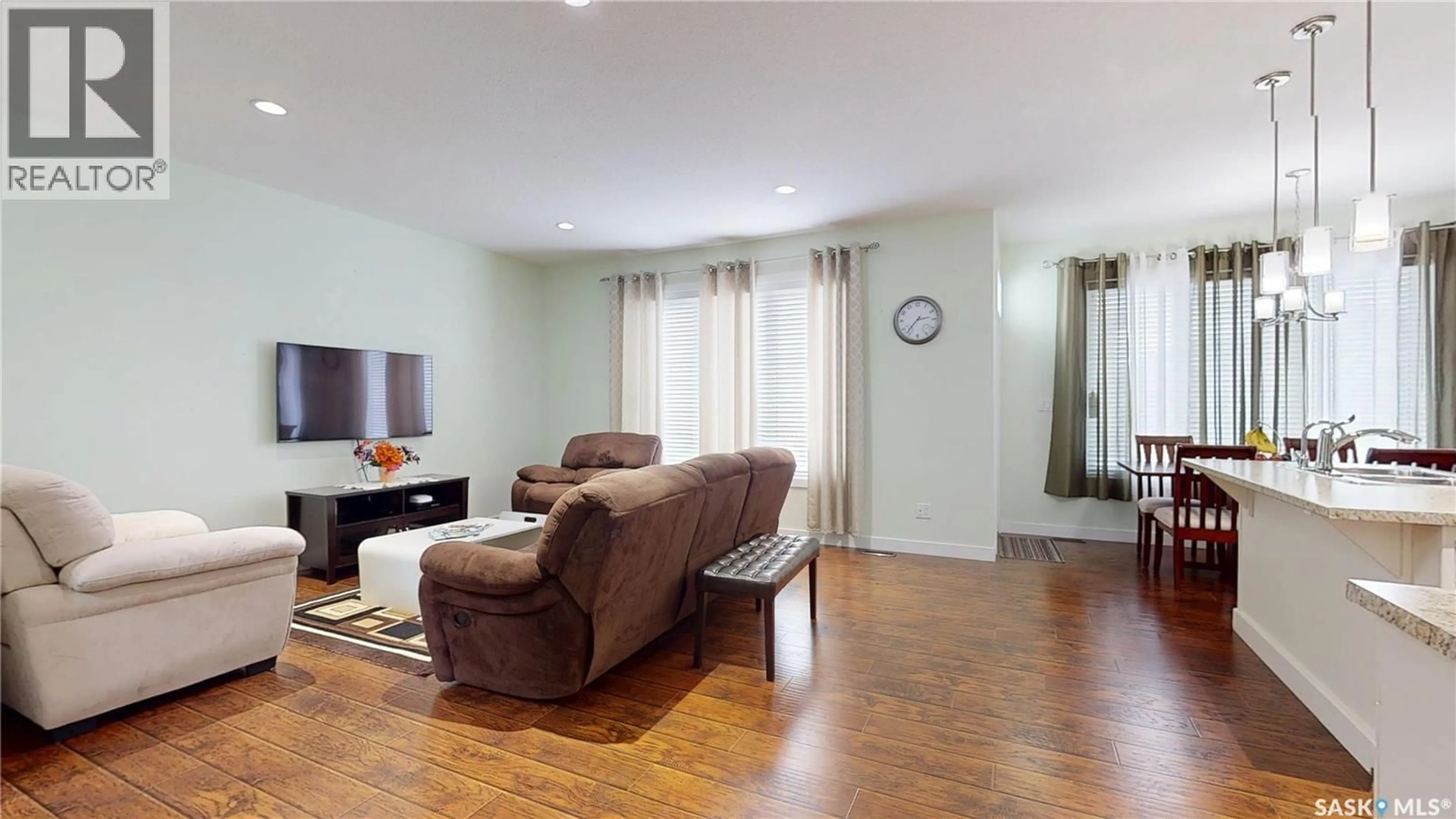 Living room with furniture, wood/laminate floor for 2632 MAKOWSKY CRESCENT, Regina Saskatchewan S4X0M8