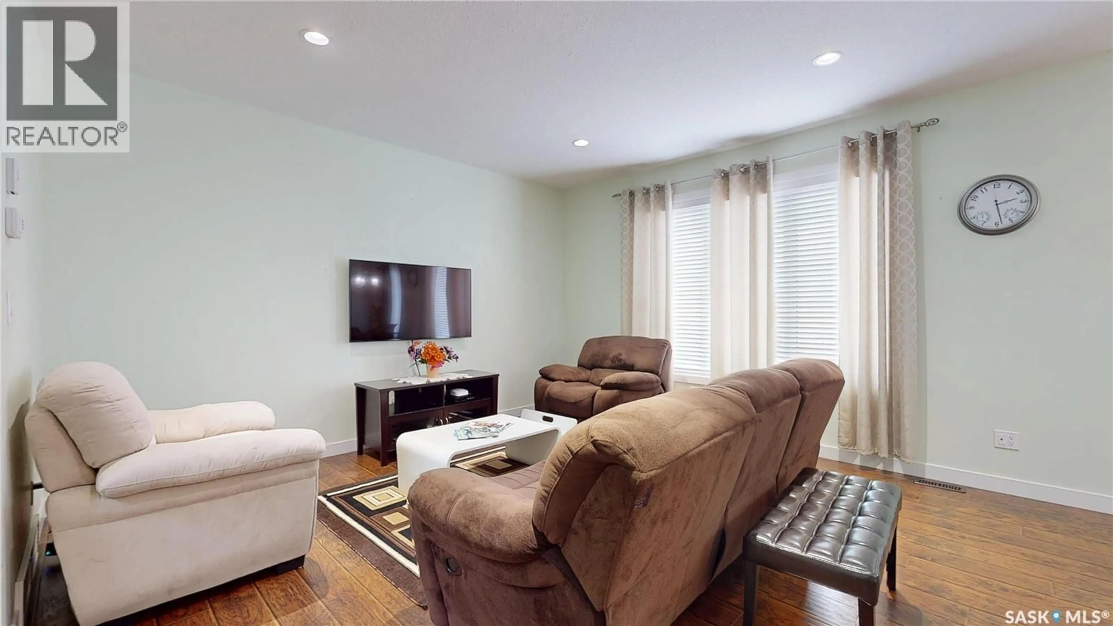 Living room with furniture, wood/laminate floor for 2632 MAKOWSKY CRESCENT, Regina Saskatchewan S4X0M8