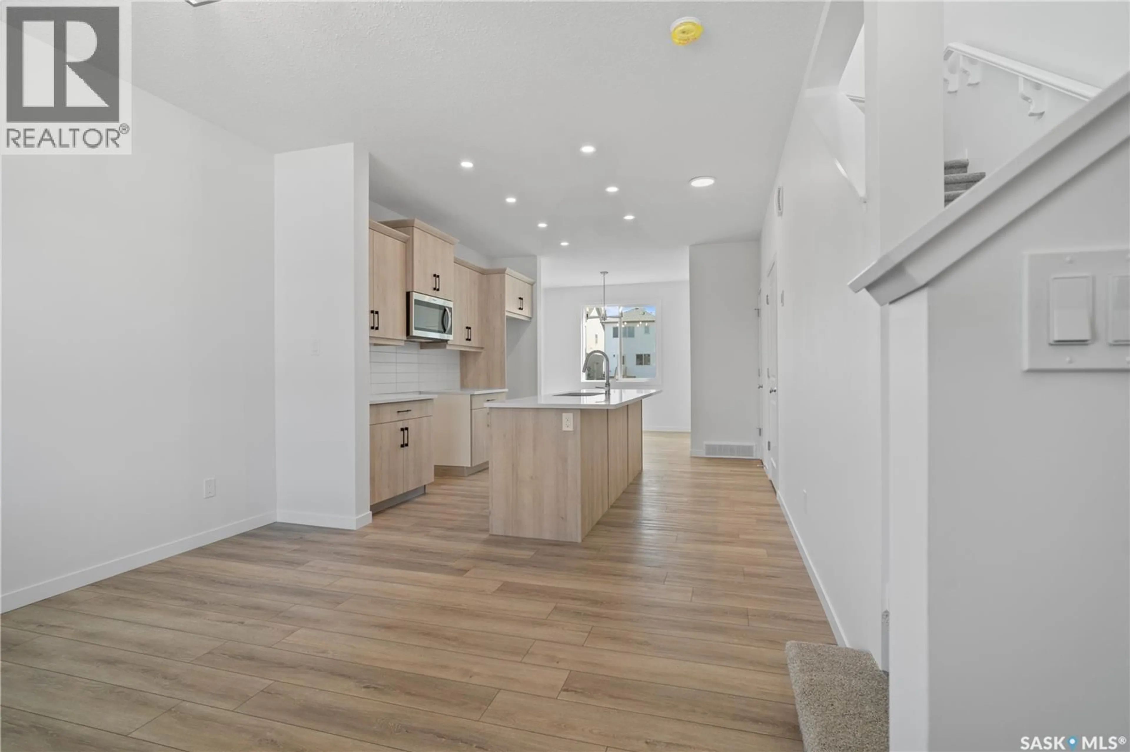 Open concept kitchen, wood/laminate floor for 3151 BOWEN STREET, Regina Saskatchewan S4V4C6