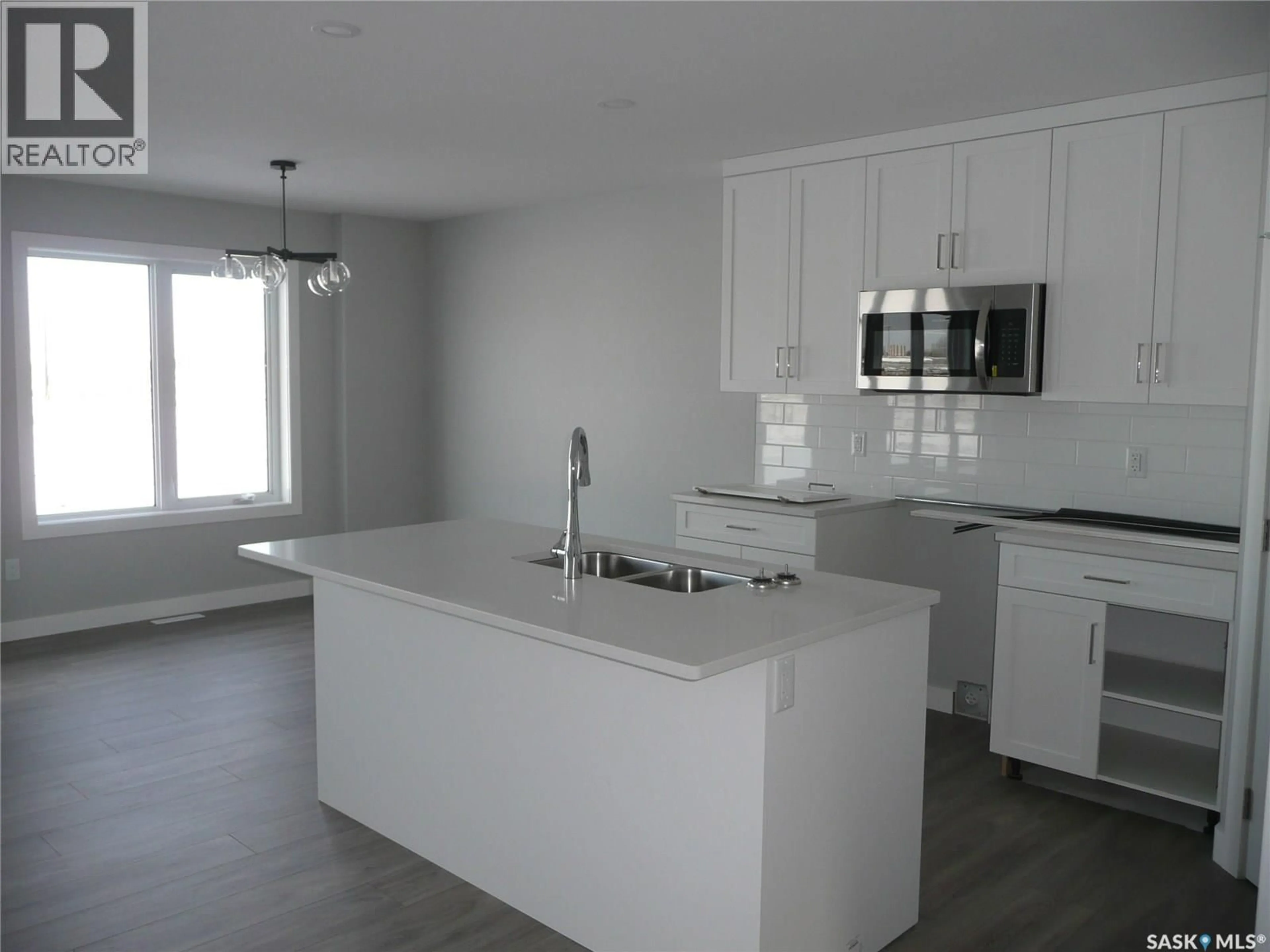 Open concept kitchen, unknown for 317 COCKCROFT STREET, Saskatoon Saskatchewan S7V1Y9