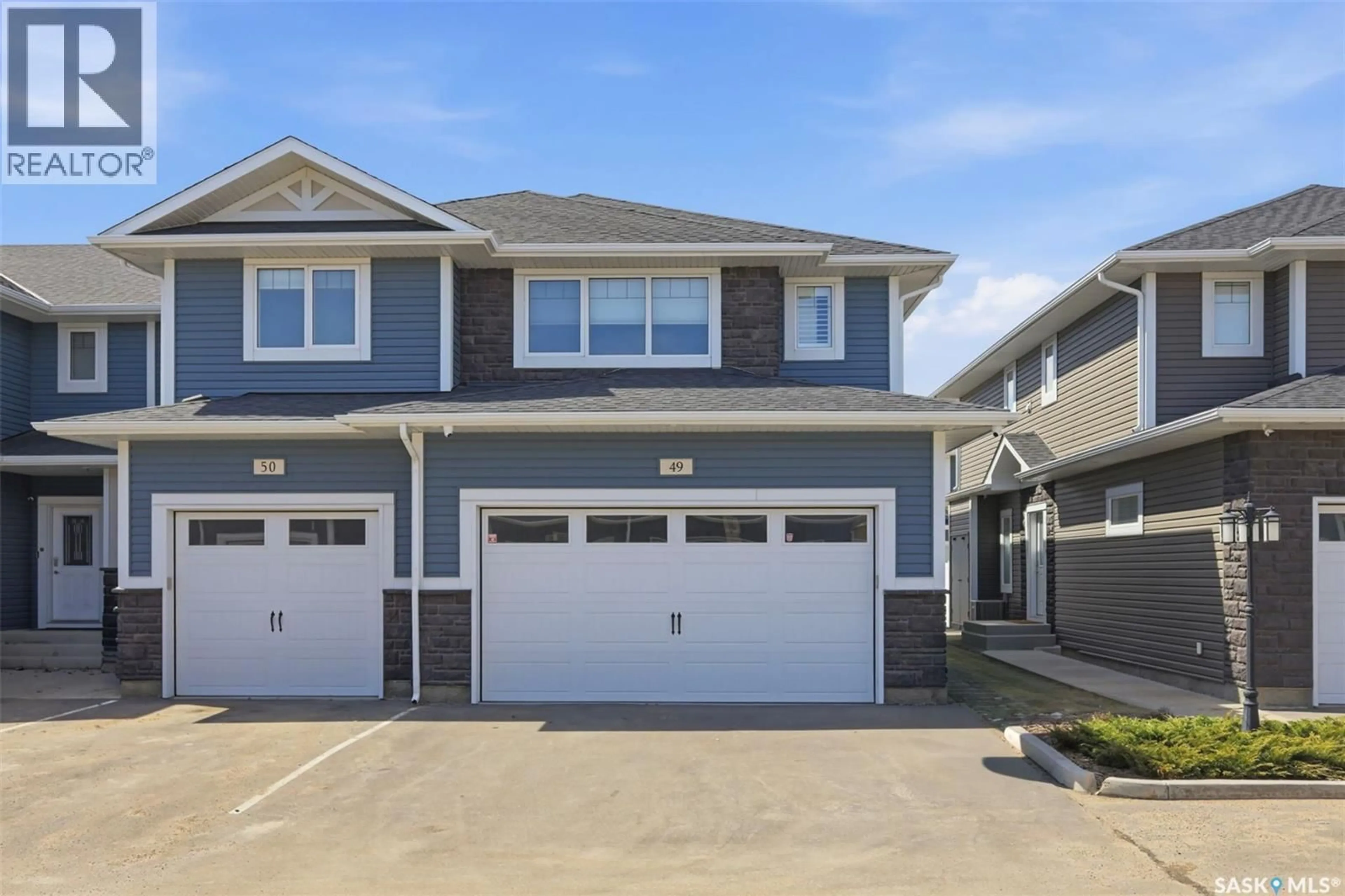 Home with vinyl exterior material, street for 49 115 VELTKAMP CRESCENT, Saskatoon Saskatchewan S7T0T7