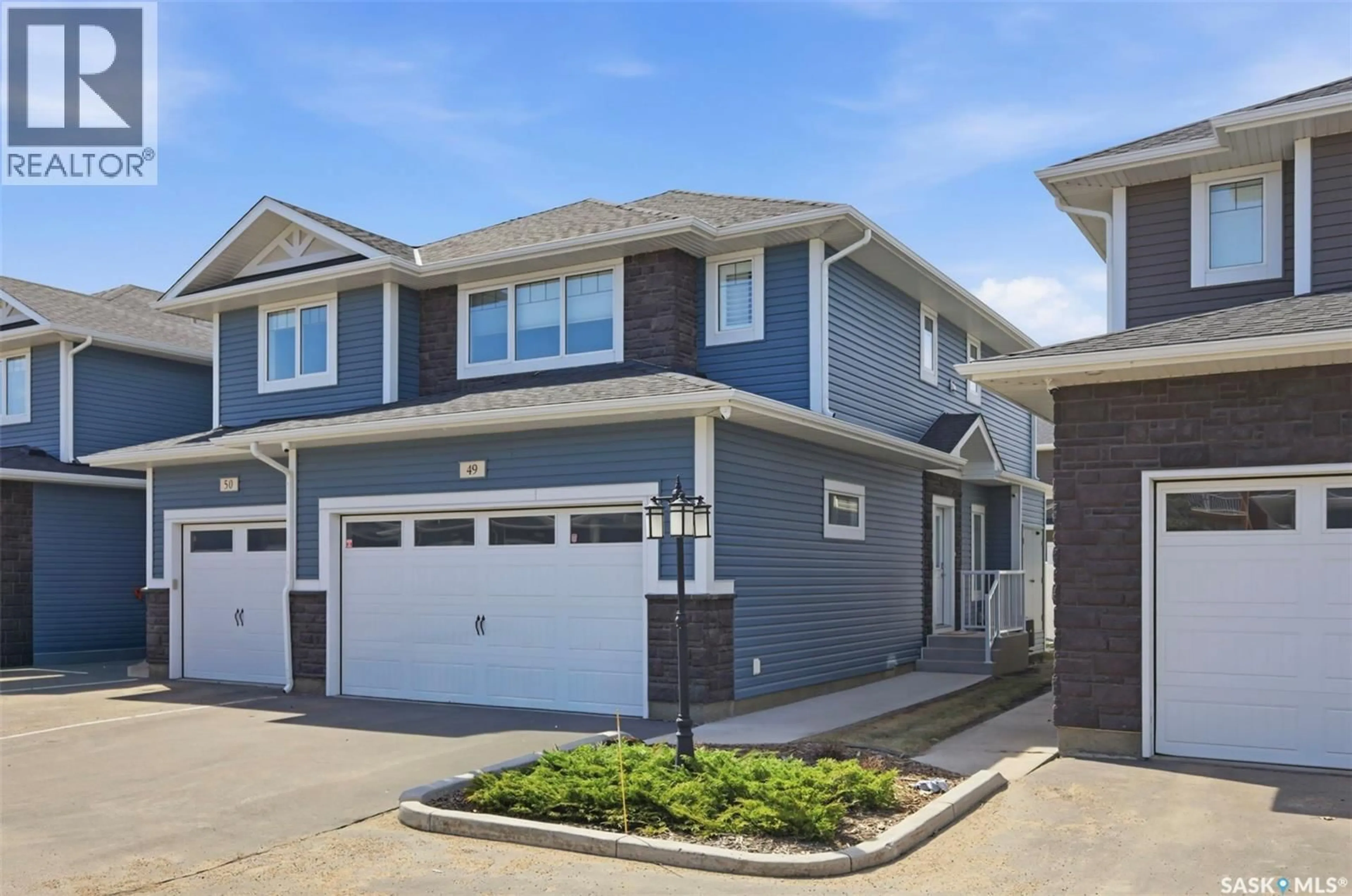 Home with vinyl exterior material, street for 49 115 VELTKAMP CRESCENT, Saskatoon Saskatchewan S7T0T7