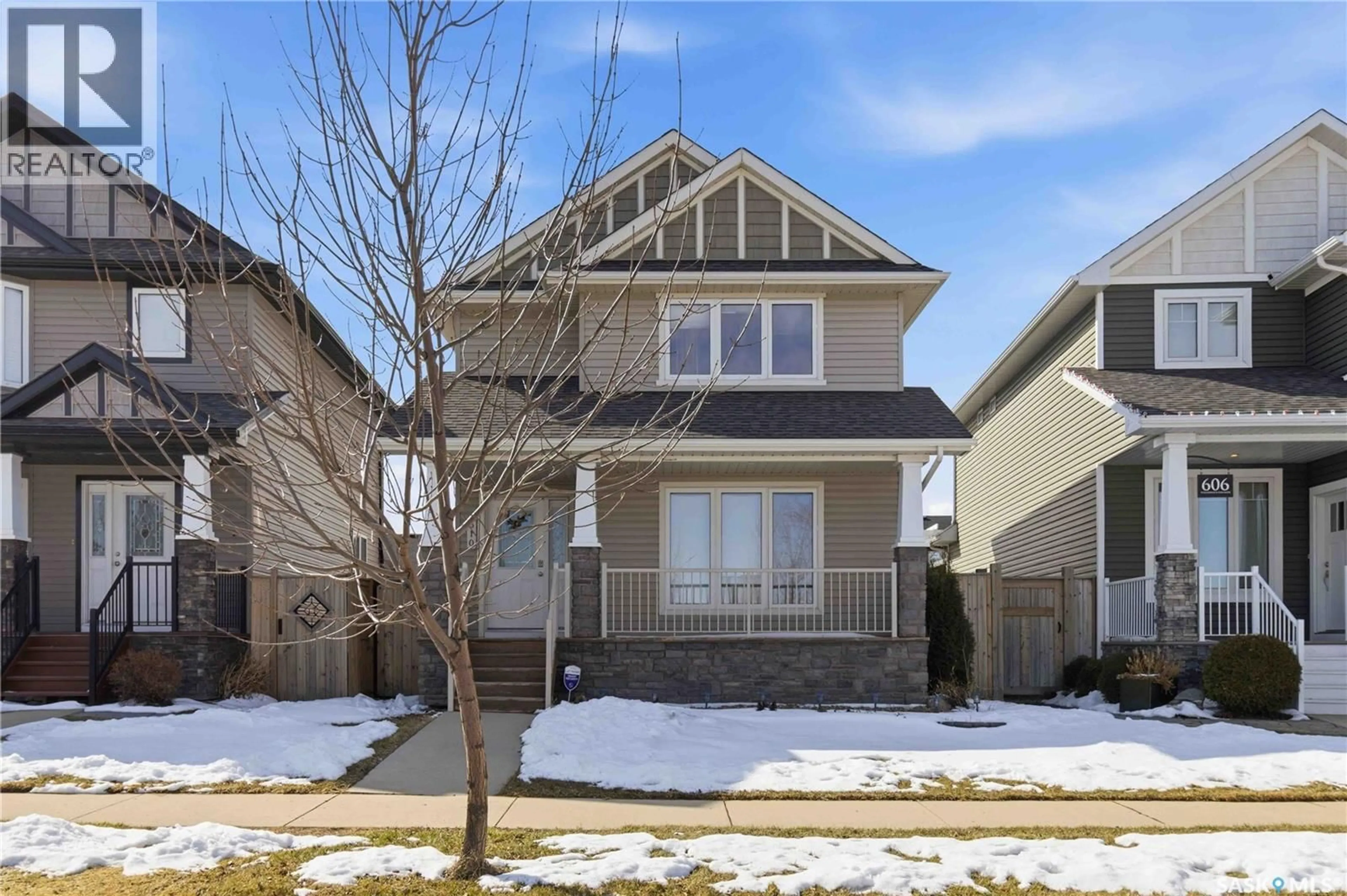 Home with vinyl exterior material, street for 610 STONEBRIDGE COMMON, Saskatoon Saskatchewan S7K0M9
