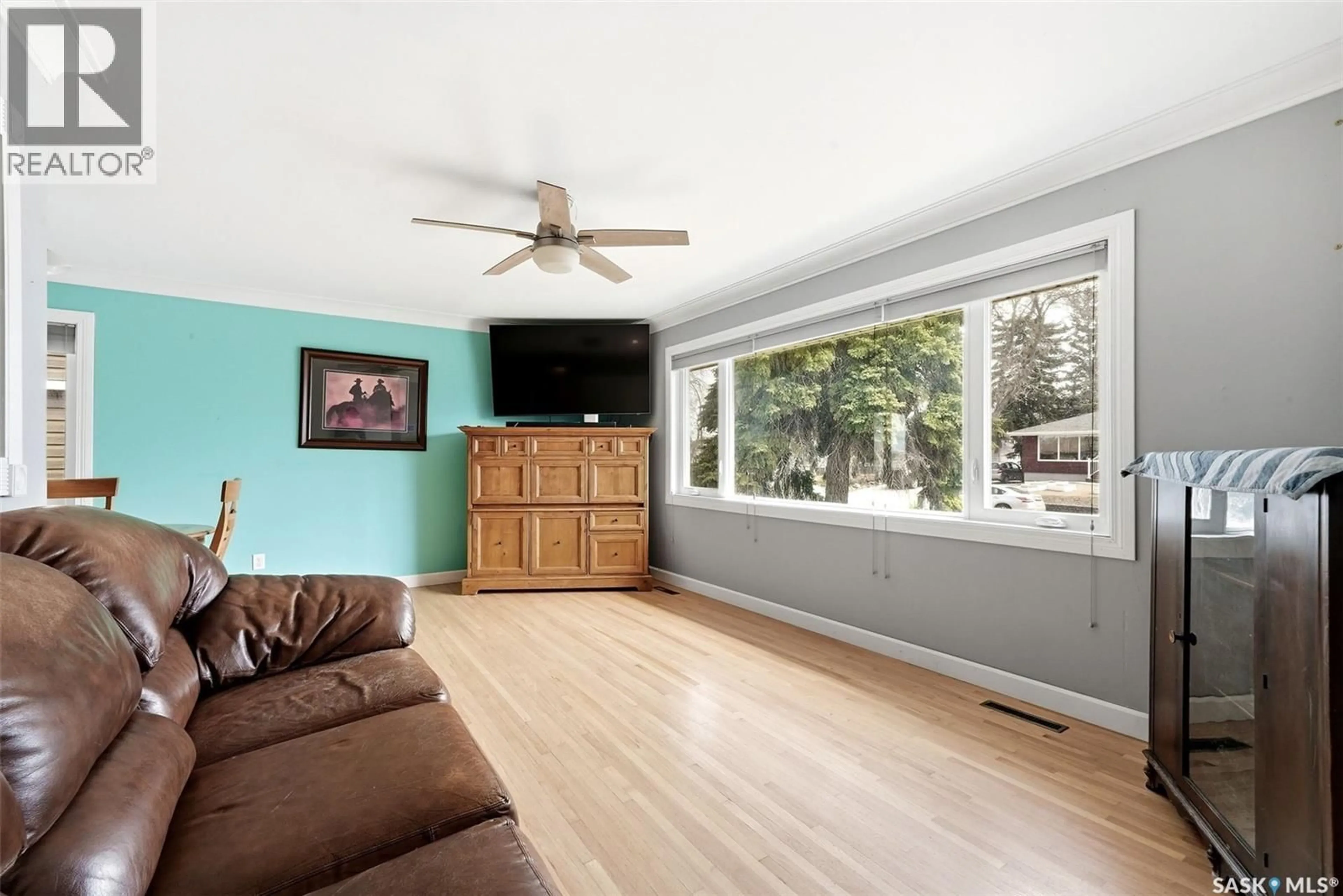 Living room with furniture, wood/laminate floor for 2510 EDWARD STREET, Regina Saskatchewan S4S0M8