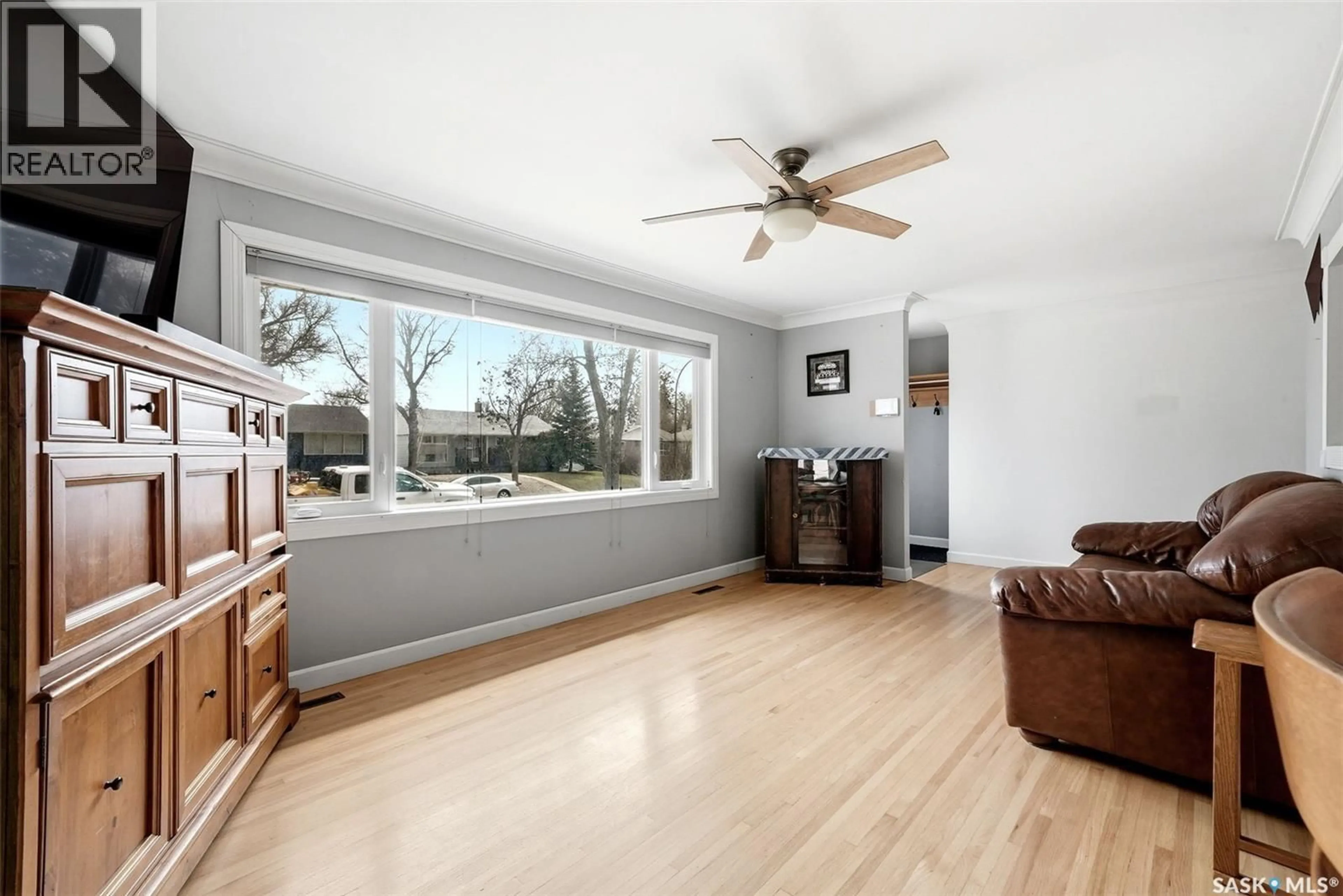 Living room with furniture, wood/laminate floor for 2510 EDWARD STREET, Regina Saskatchewan S4S0M8