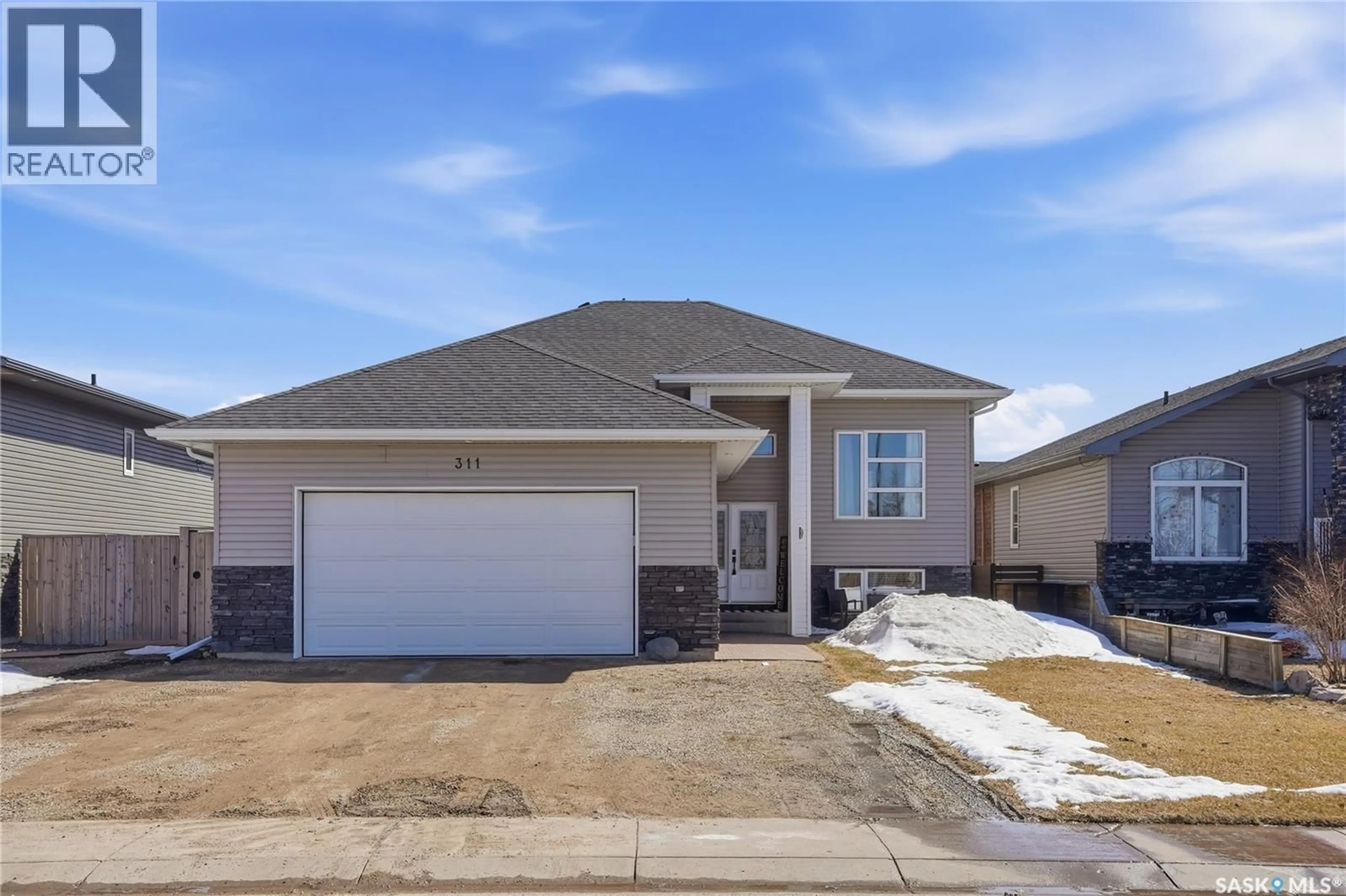 Home with vinyl exterior material, street for 311 RIGMOR STREET, Warman Saskatchewan S0K4S3
