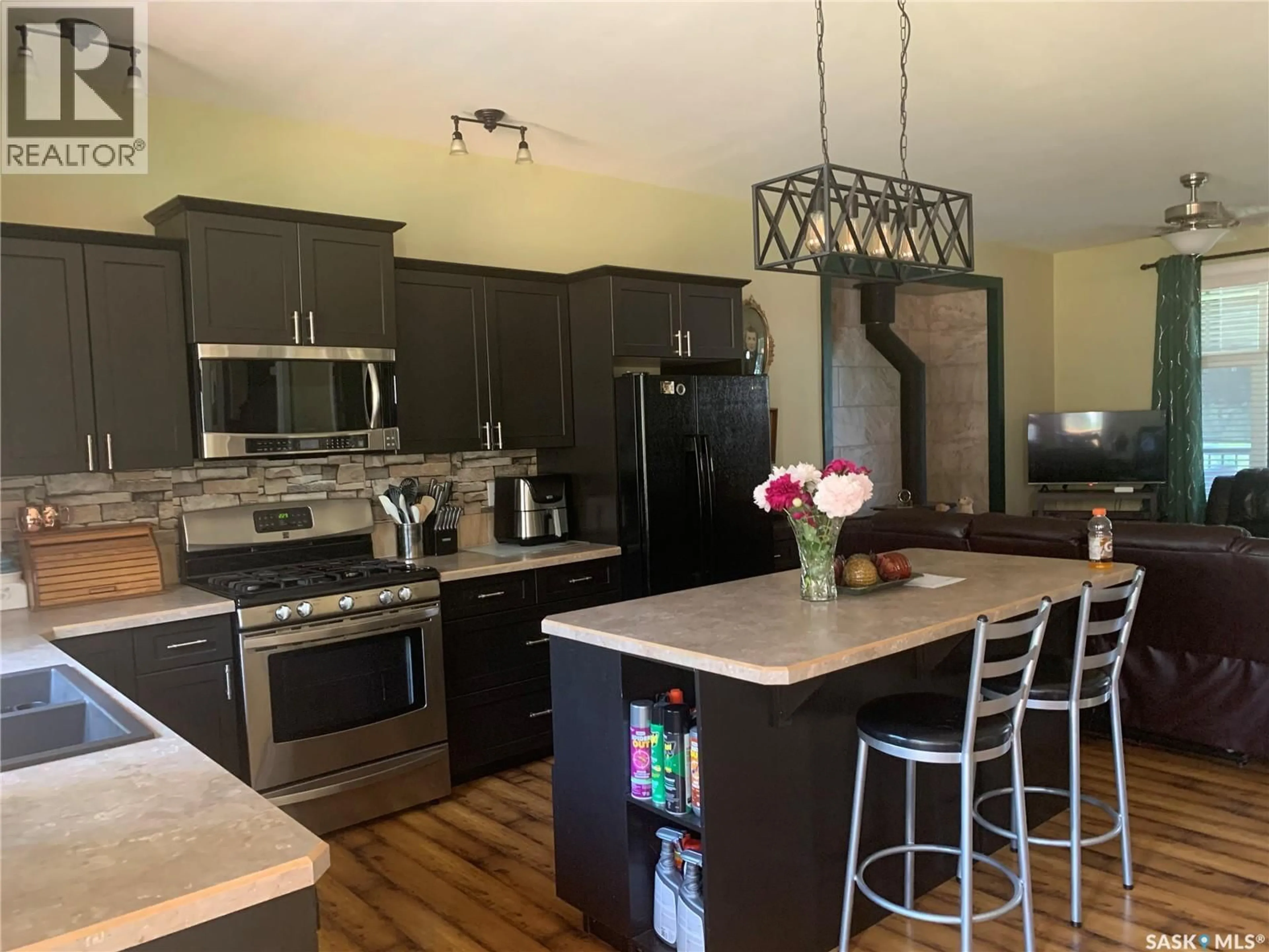 Open concept kitchen, wood/laminate floor for 303B LAC DES ILES ROAD, Beaver River Rm No. 622 Saskatchewan S0M1A0