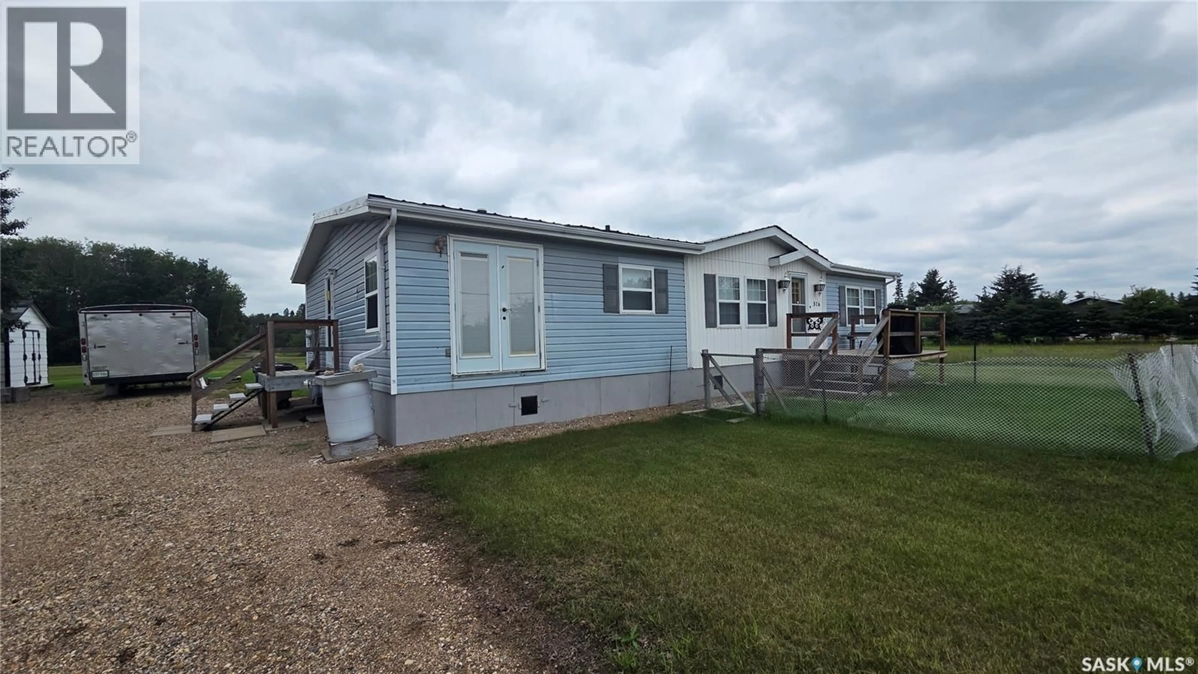 Home with vinyl exterior material, street for 316 1ST STREET, Archerwill Saskatchewan S0E0B0