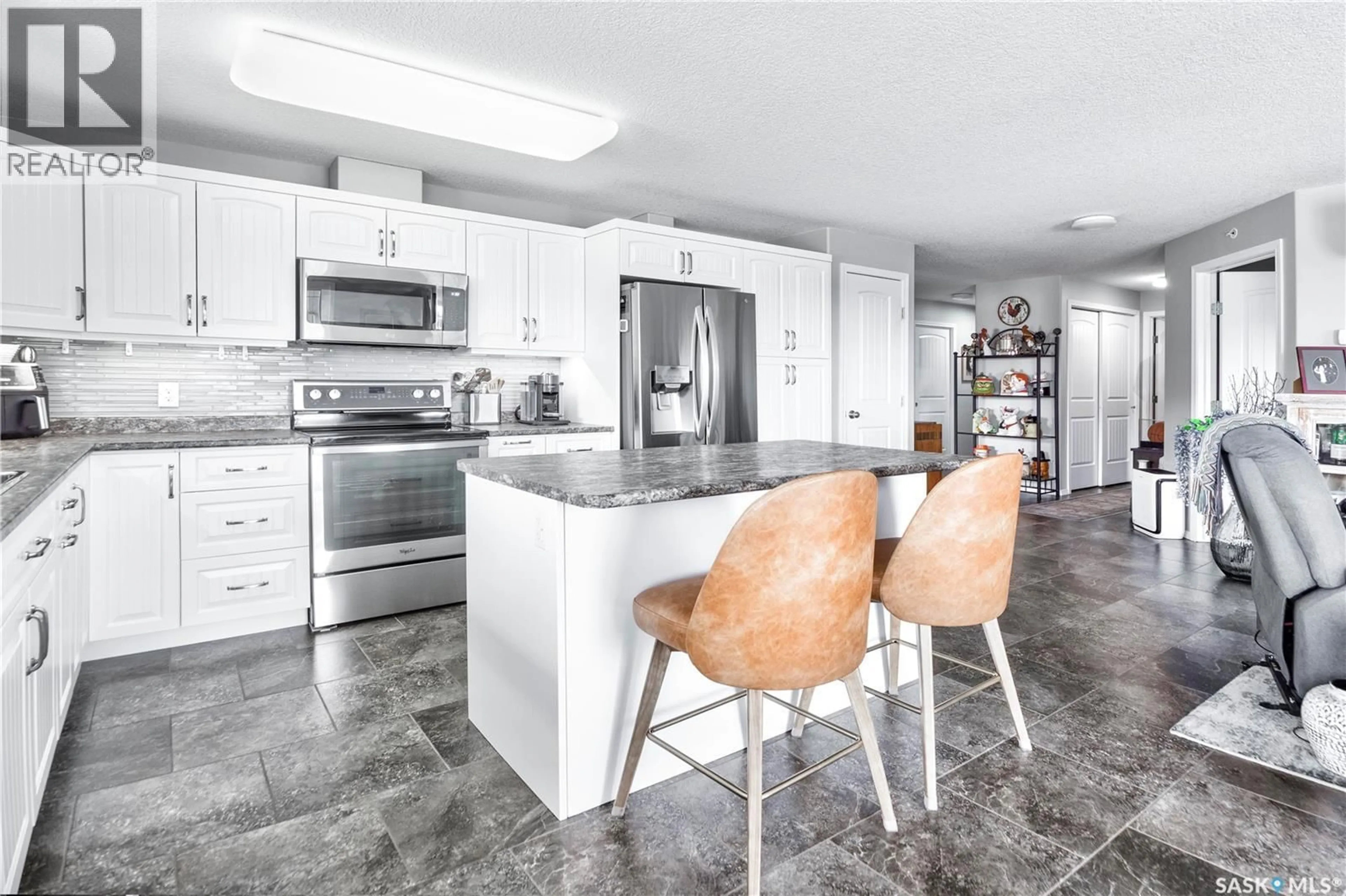 Open concept kitchen, ceramic/tile floor for 403 - 2781 WOODBRIDGE DRIVE, Prince Albert Saskatchewan S6V3Z9