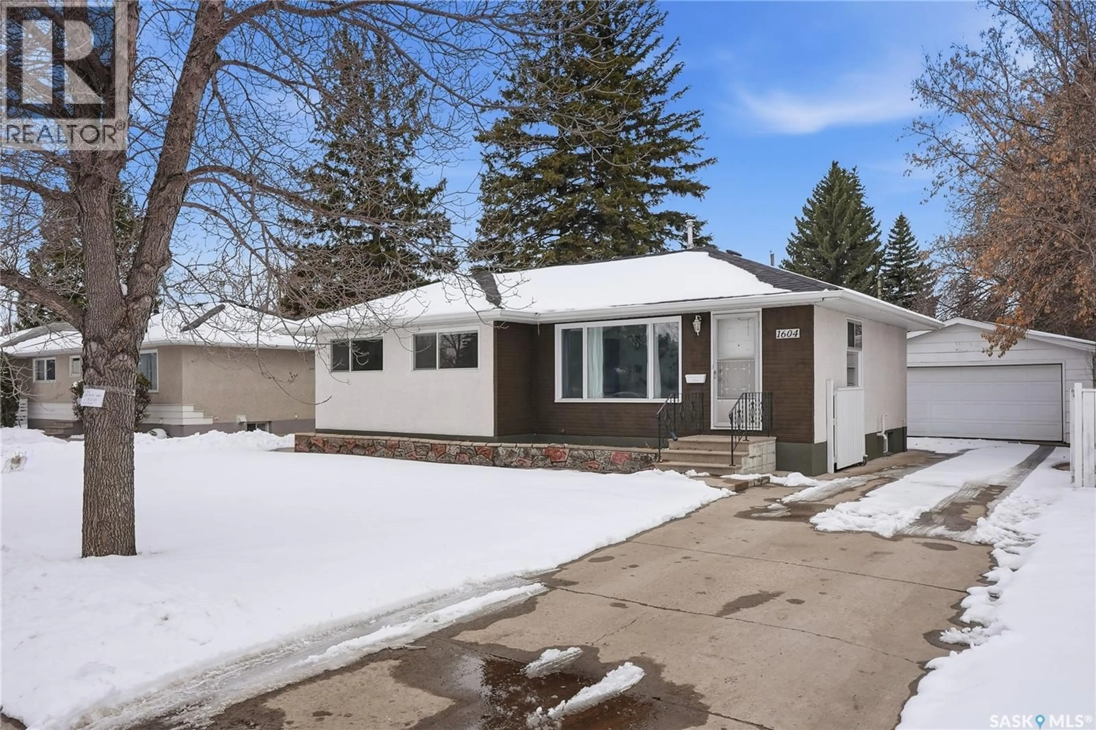 Home with vinyl exterior material, street for 1604 PRESTON AVENUE, Saskatoon Saskatchewan S7H2V8