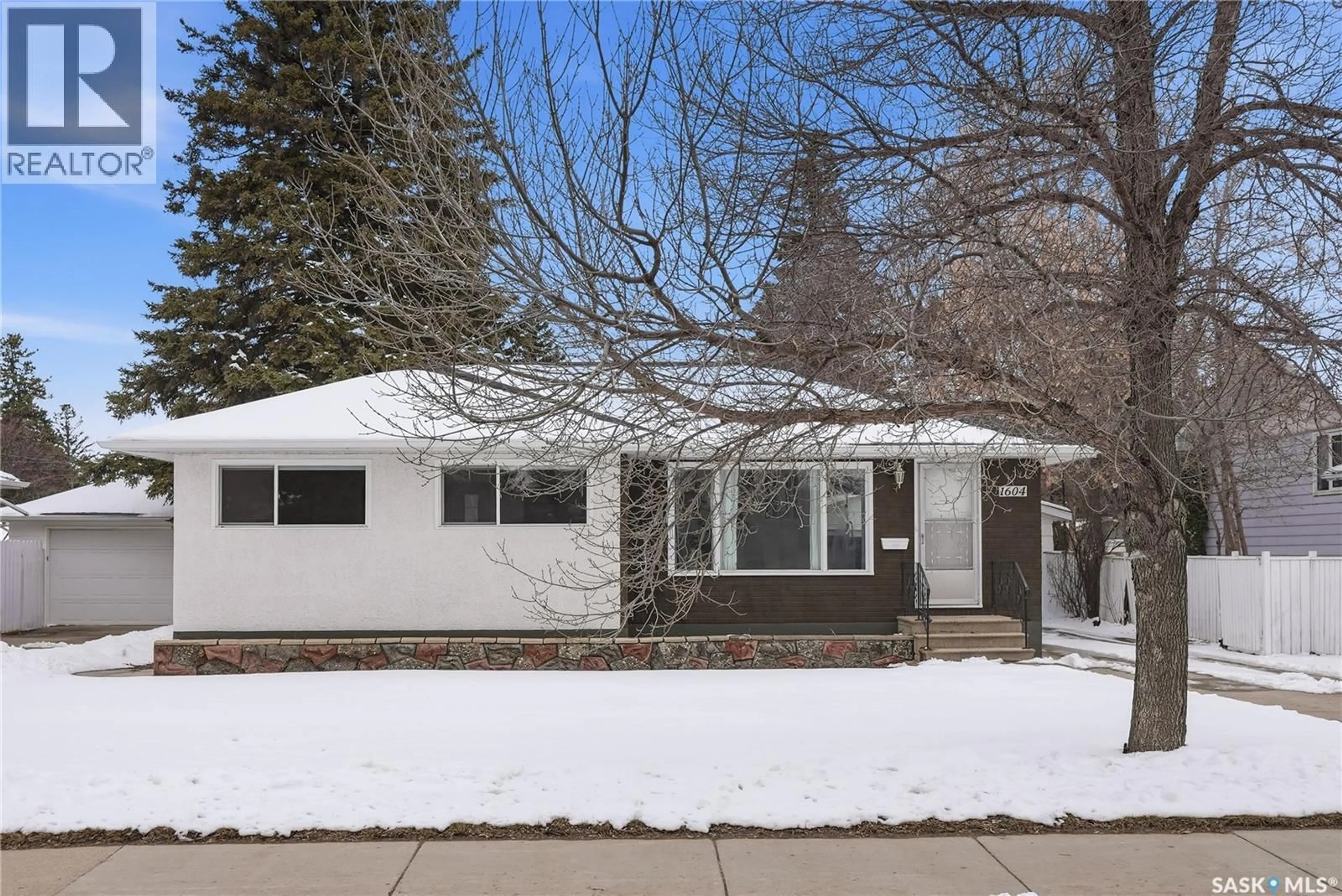 Home with vinyl exterior material, street for 1604 PRESTON AVENUE, Saskatoon Saskatchewan S7H2V8