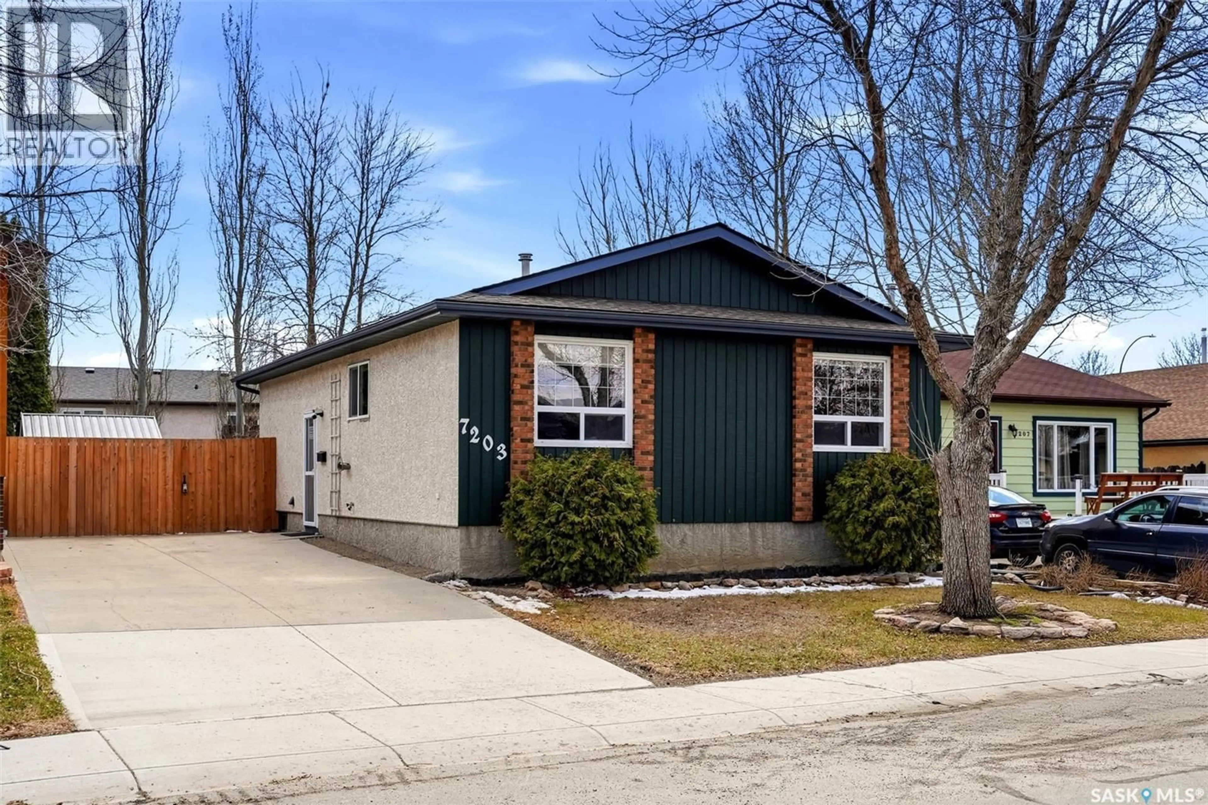 Home with vinyl exterior material, street for 7203 LAWRENCE DRIVE, Regina Saskatchewan S4X3X7