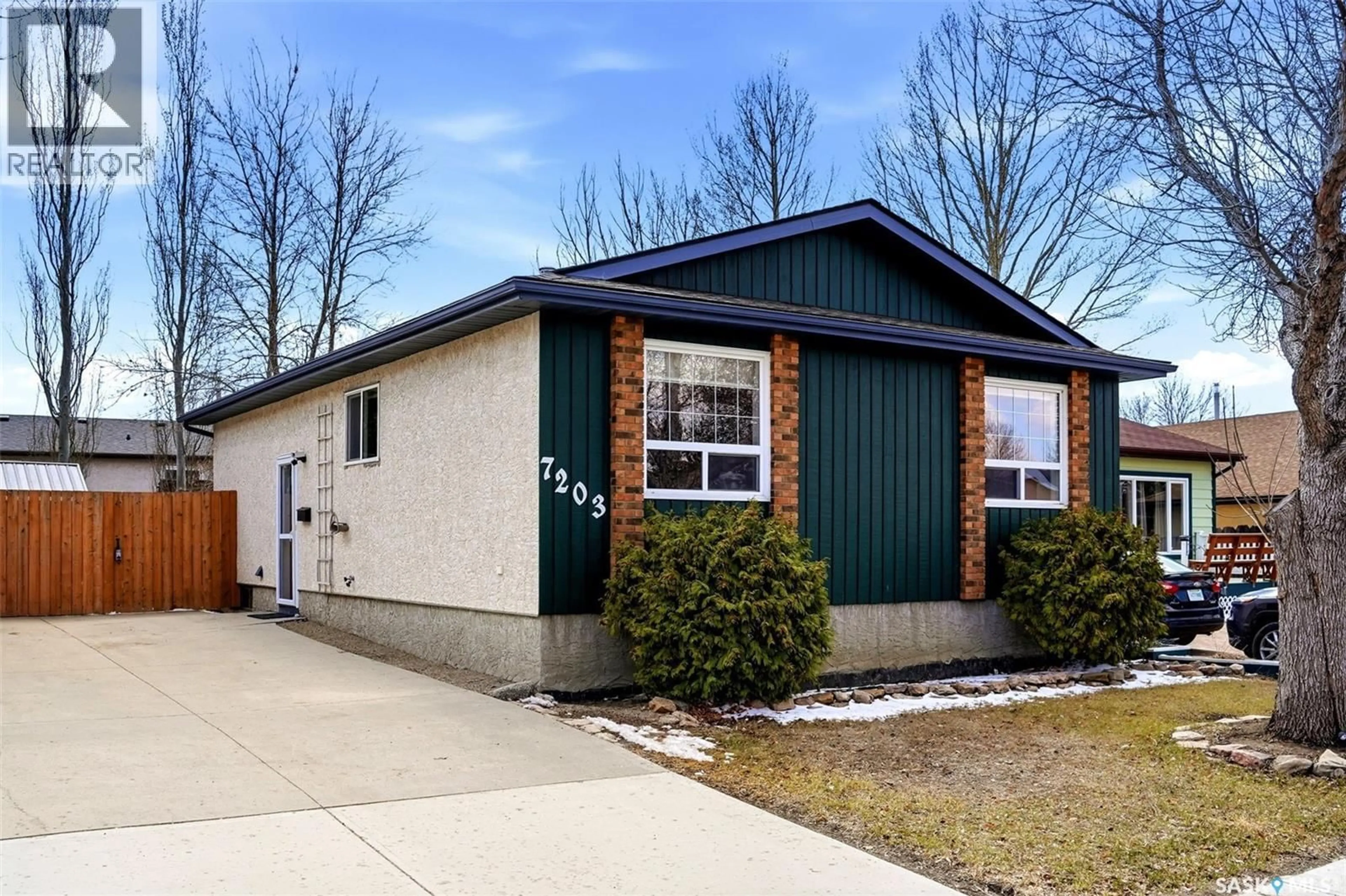 Home with vinyl exterior material, street for 7203 LAWRENCE DRIVE, Regina Saskatchewan S4X3X7