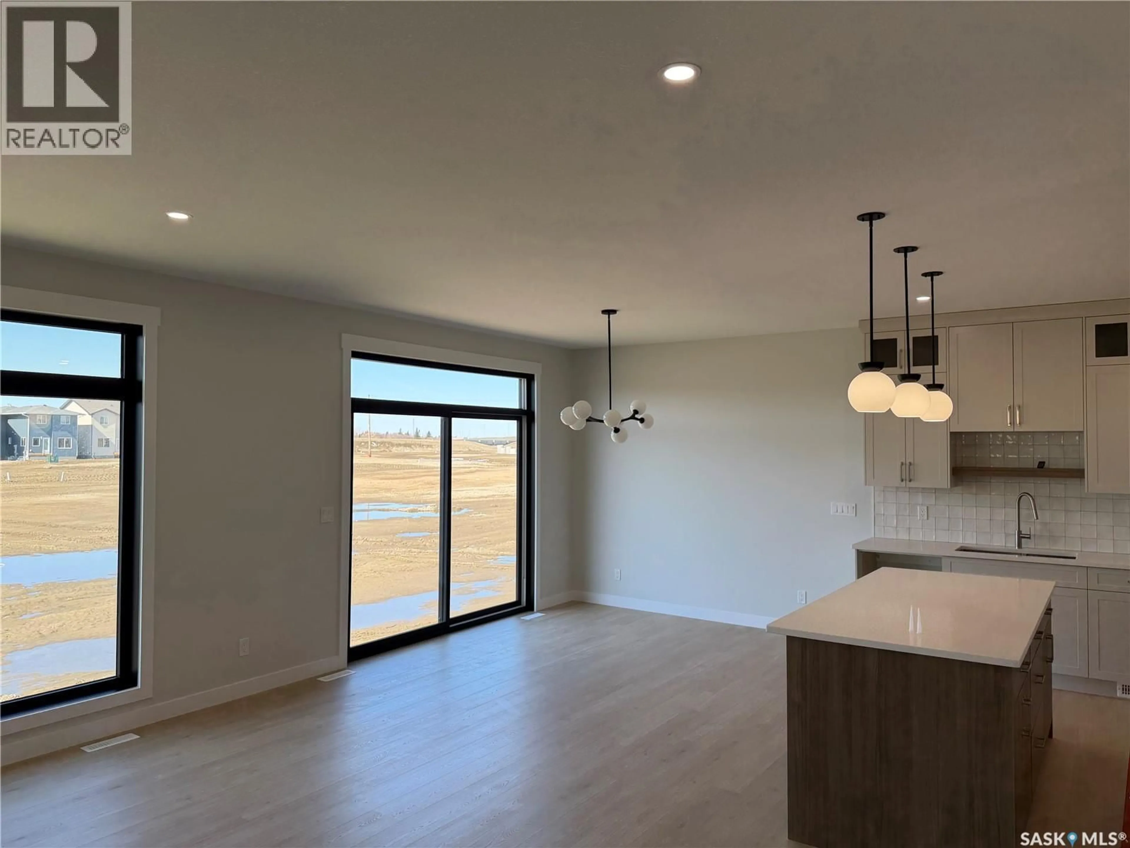 Open concept kitchen, unknown for 310 TRAEGER MANOR, Saskatoon Saskatchewan S7V1Z4