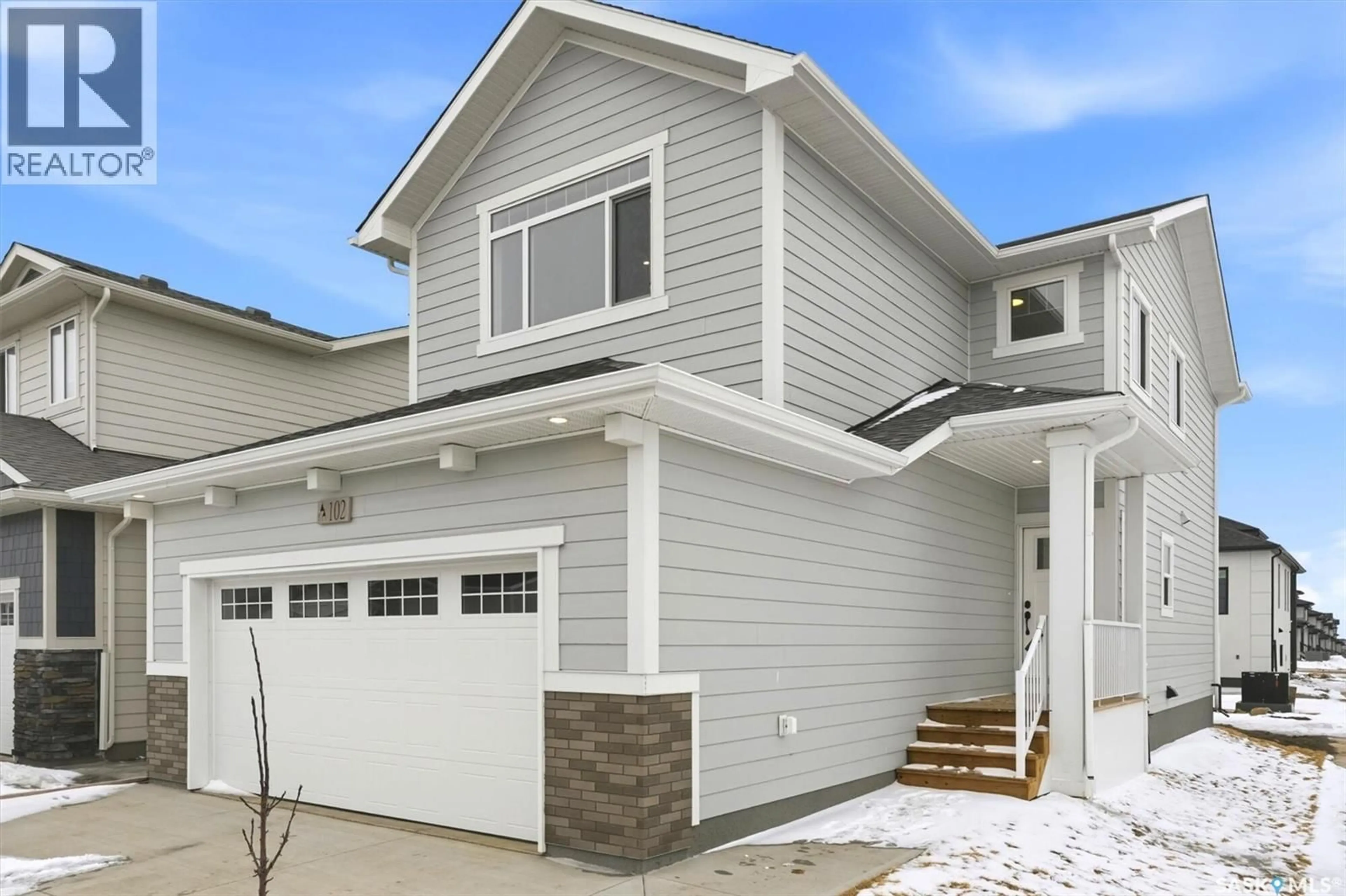 Home with vinyl exterior material, street for 422 LESKIW BEND, Saskatoon Saskatchewan S7W0L8
