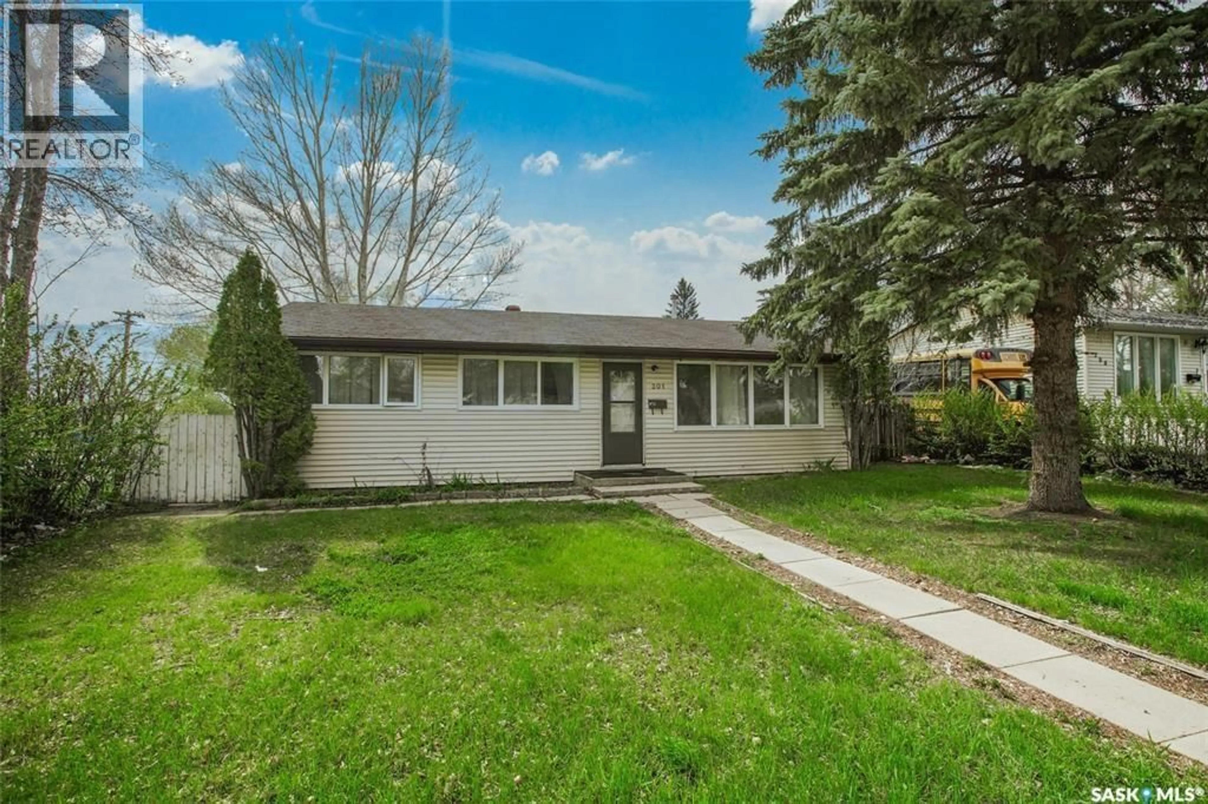 Home with vinyl exterior material, street for 201 V AVENUE, Saskatoon Saskatchewan S7L3E5