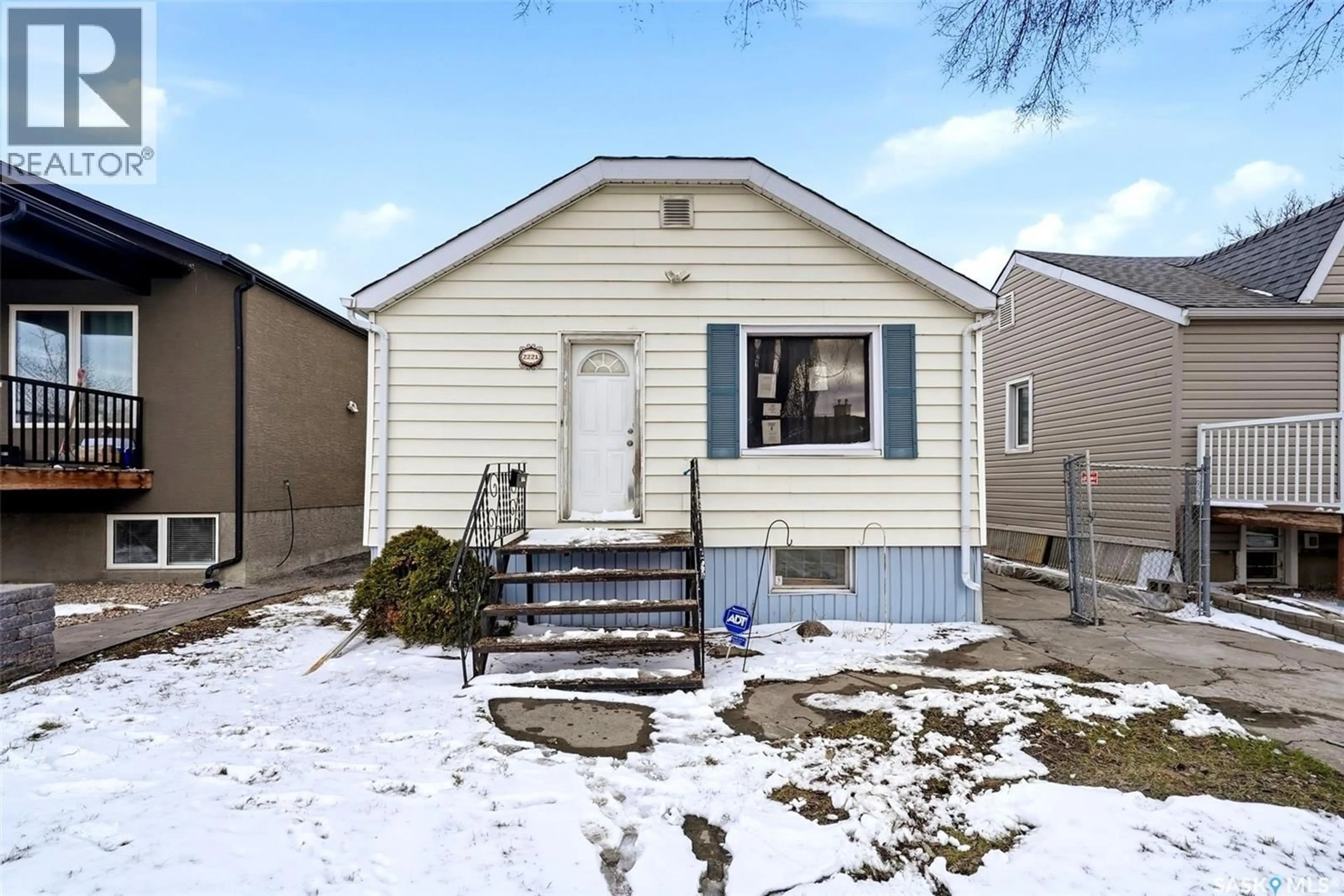 Home with vinyl exterior material, street for 2221 ATKINSON STREET, Regina Saskatchewan S4N3X2
