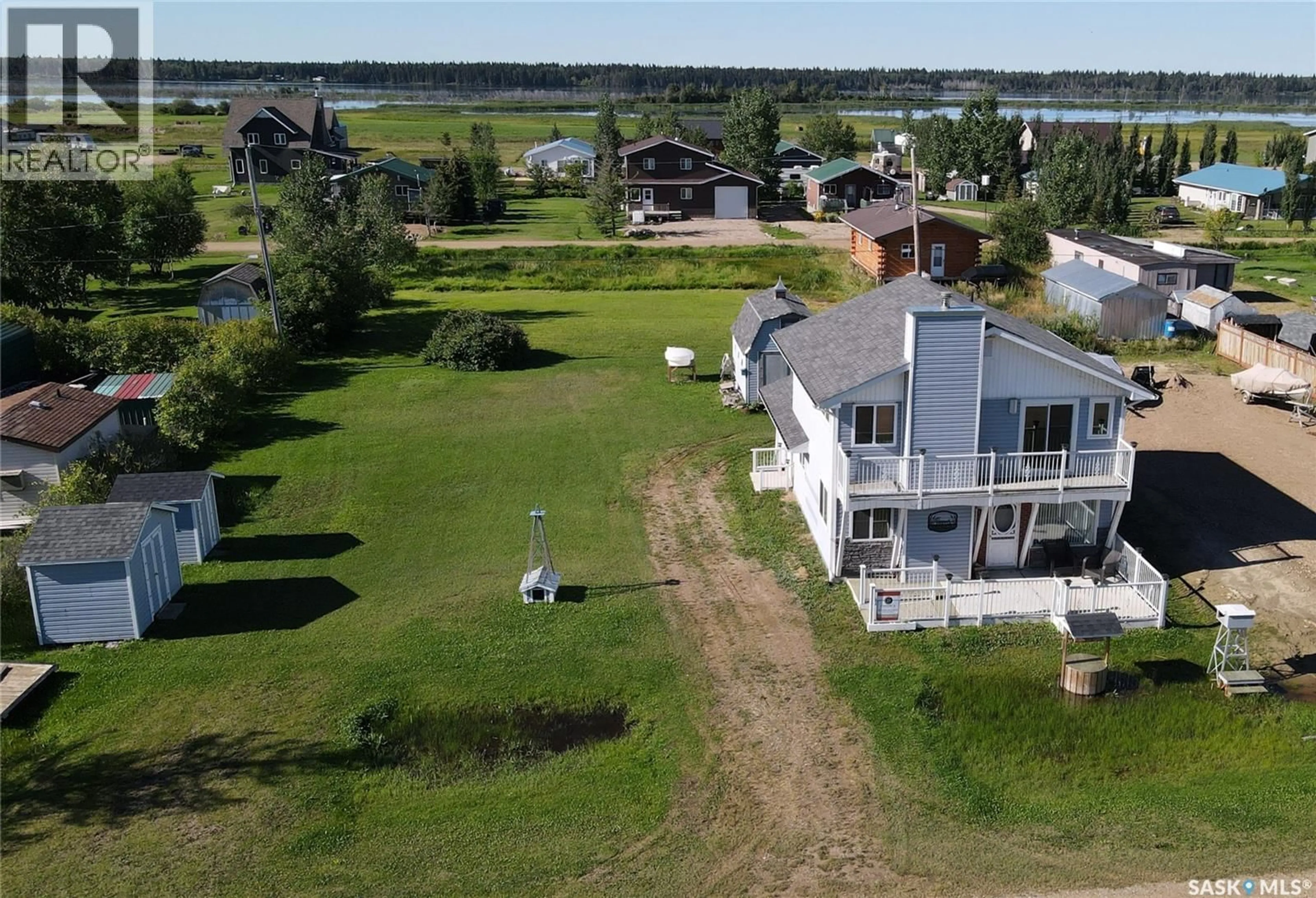A pic from outside/outdoor area/front of a property/back of a property/a pic from drone, water/lake/river/ocean view for 6 BRONCO DRIVE, Big River Rm No. 555 Saskatchewan S0J0E0