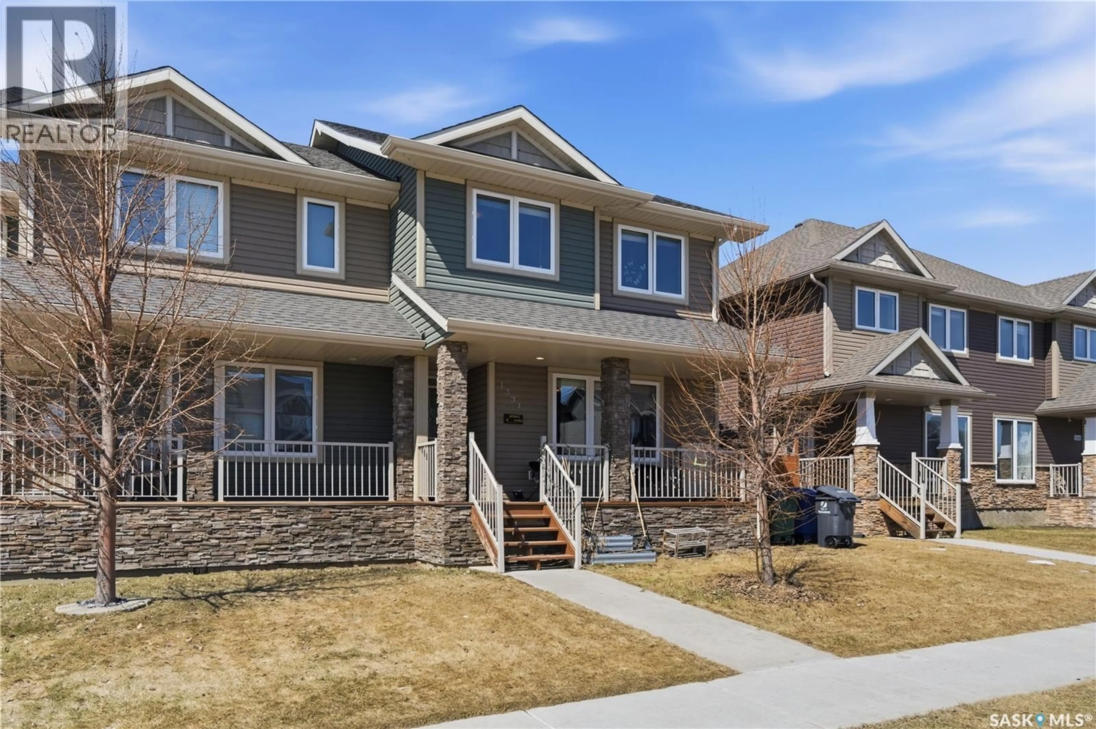 Home with brick exterior material, street for 1334 HUNTER ROAD, Saskatoon Saskatchewan S7T0S5
