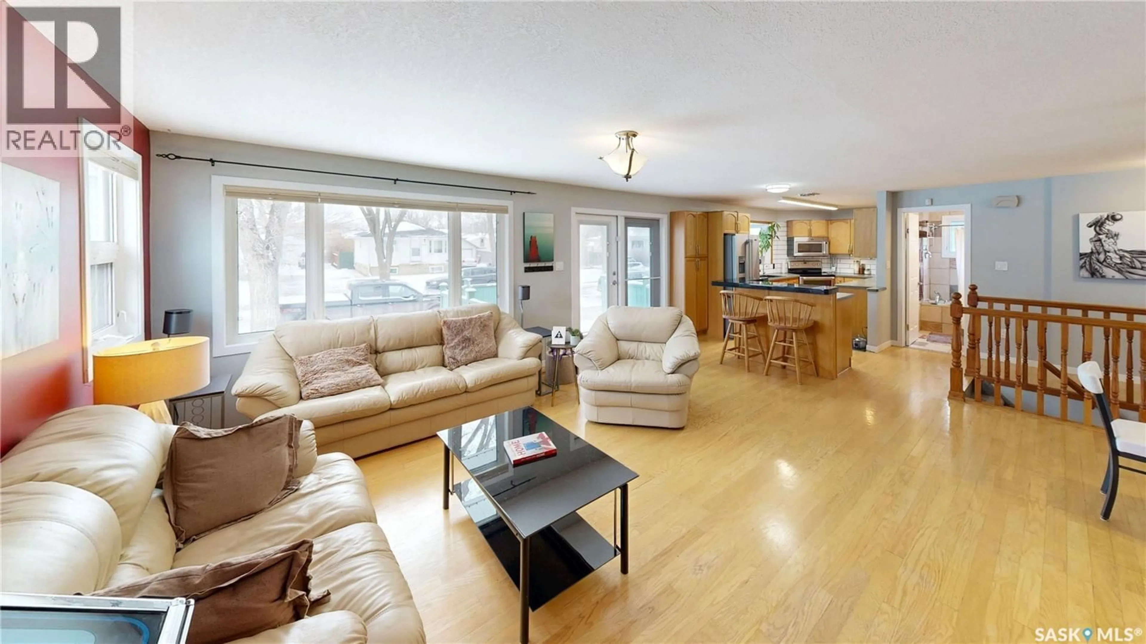 Living room with furniture, wood/laminate floor for 2440 FRANCIS STREET, Regina Saskatchewan S4N2P9