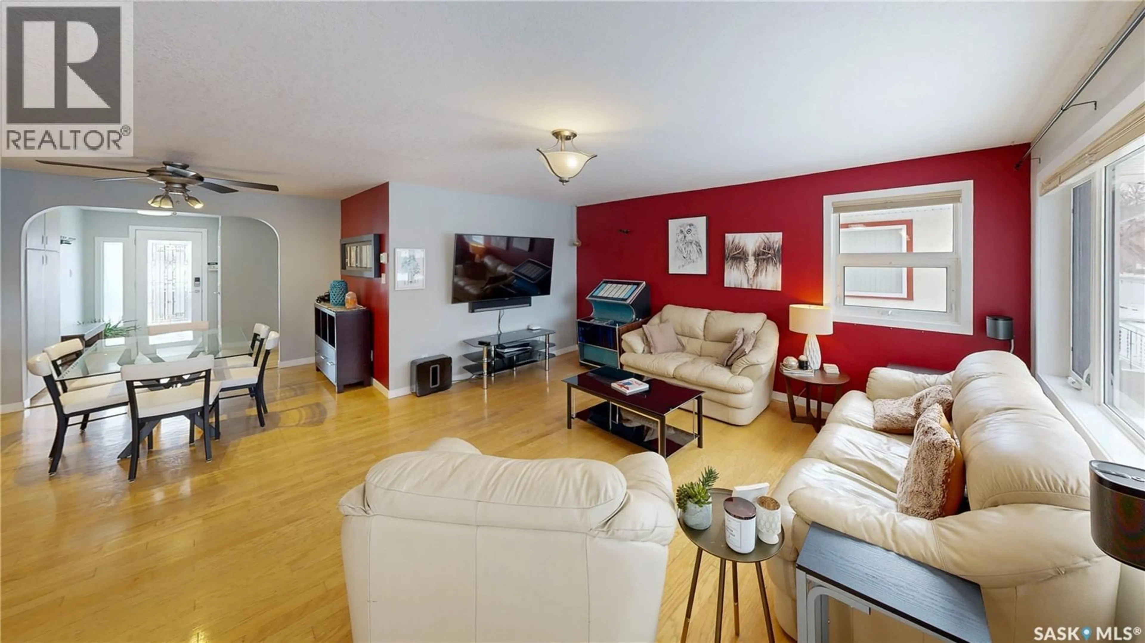 Living room with furniture, wood/laminate floor for 2440 FRANCIS STREET, Regina Saskatchewan S4N2P9