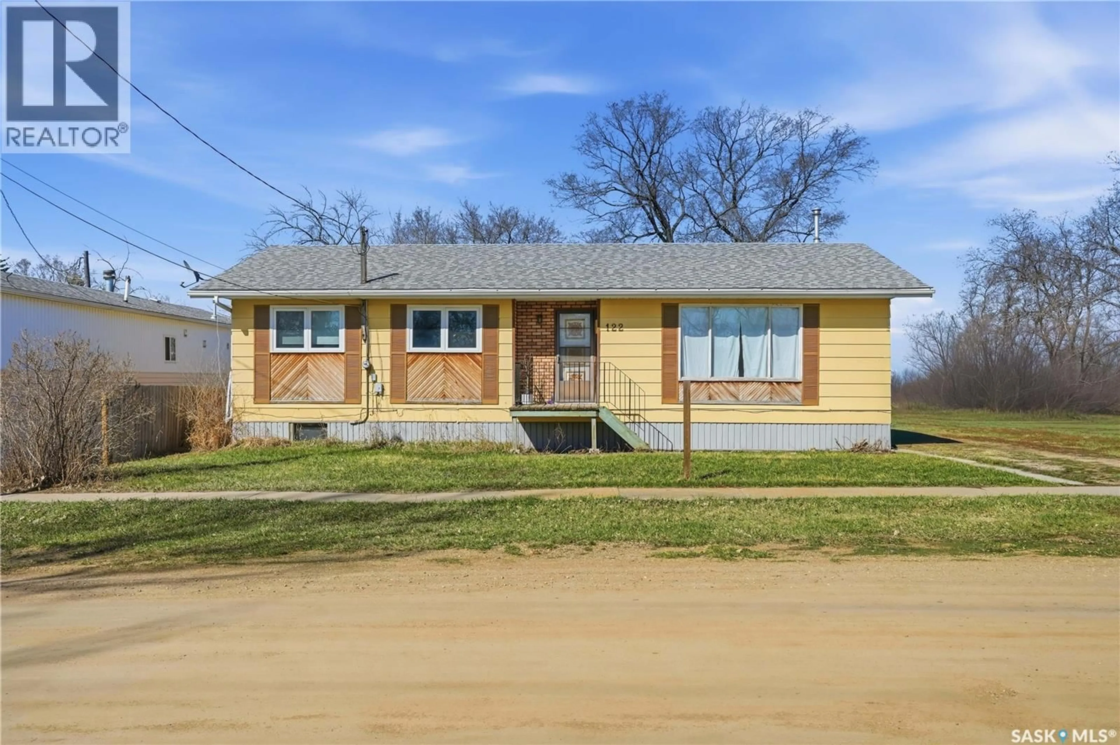 Home with brick exterior material, street for 122 1ST STREET, Chaplin Saskatchewan S0H0S0