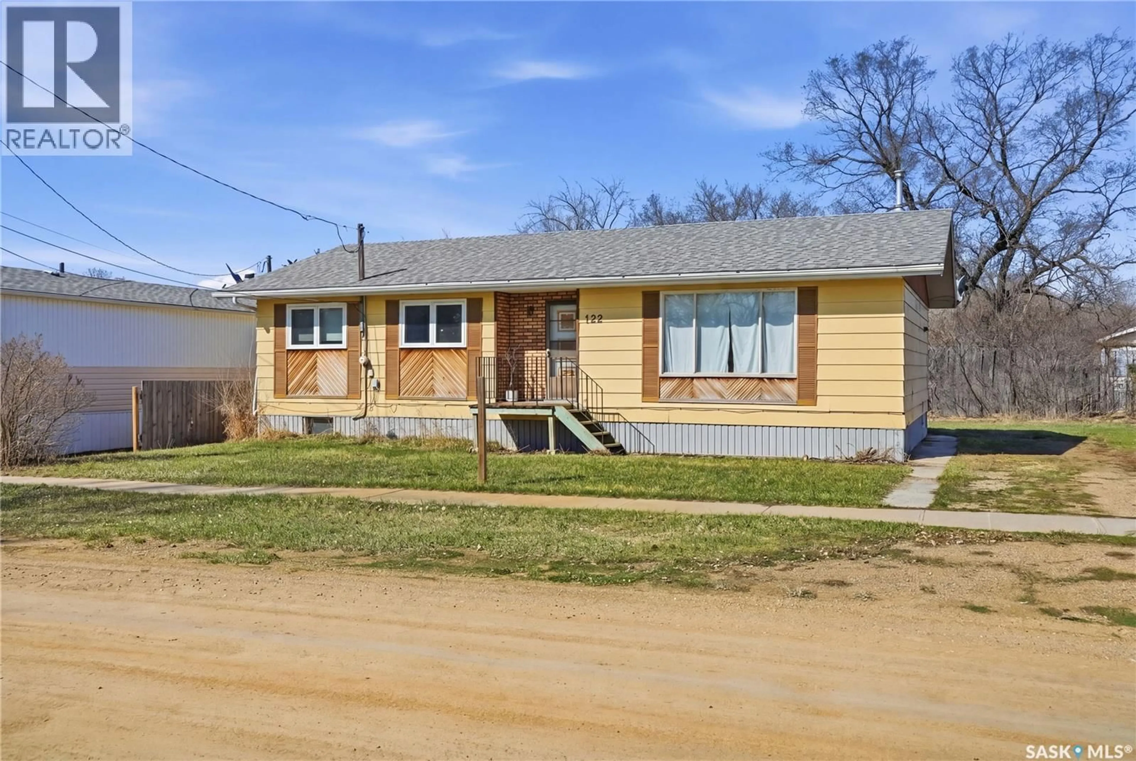 Home with brick exterior material, street for 122 1ST STREET, Chaplin Saskatchewan S0H0S0