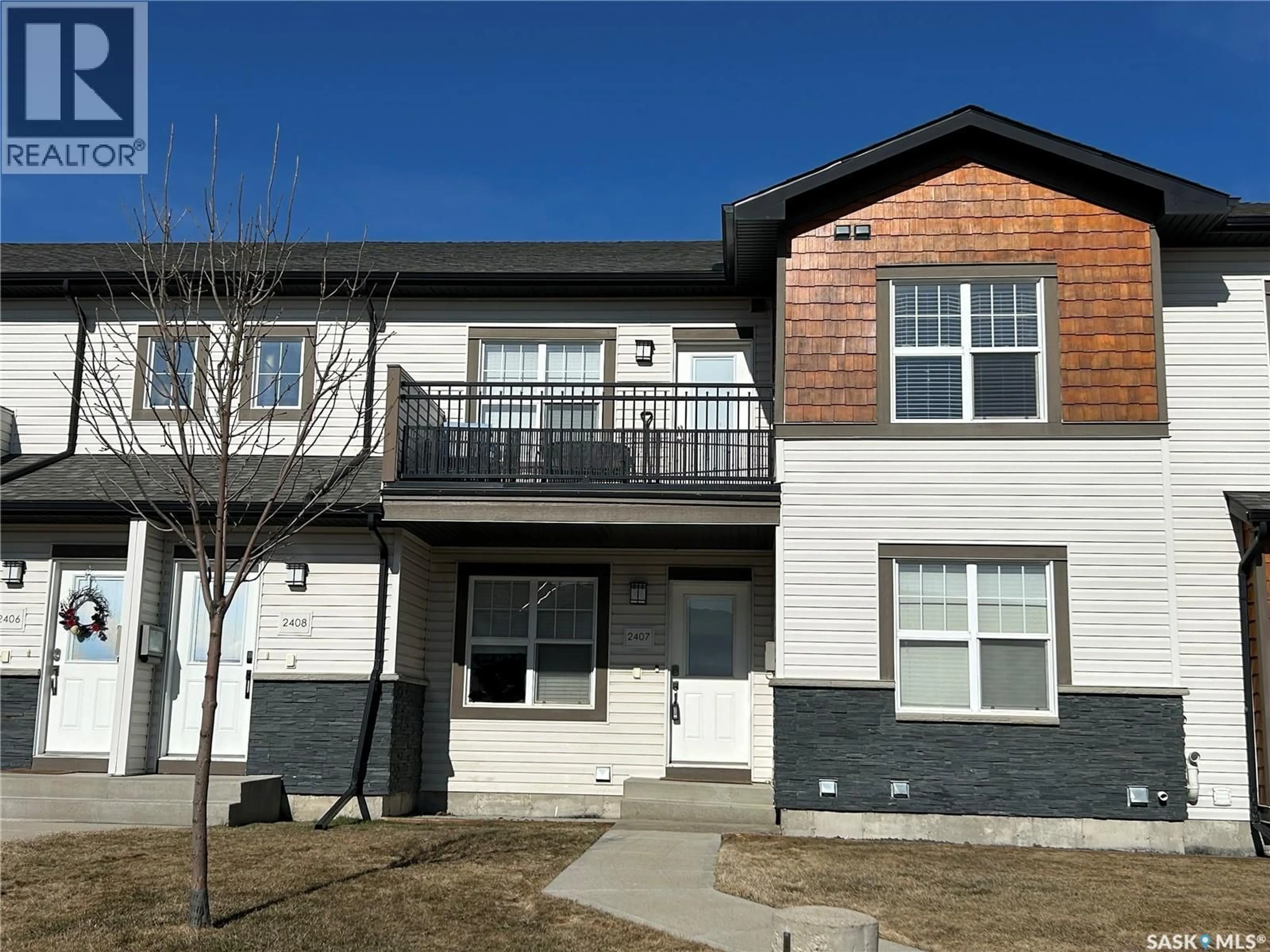 Home with vinyl exterior material, street for 1015 - 2407 PATRICK CRESCENT, Saskatoon Saskatchewan S7W0M6