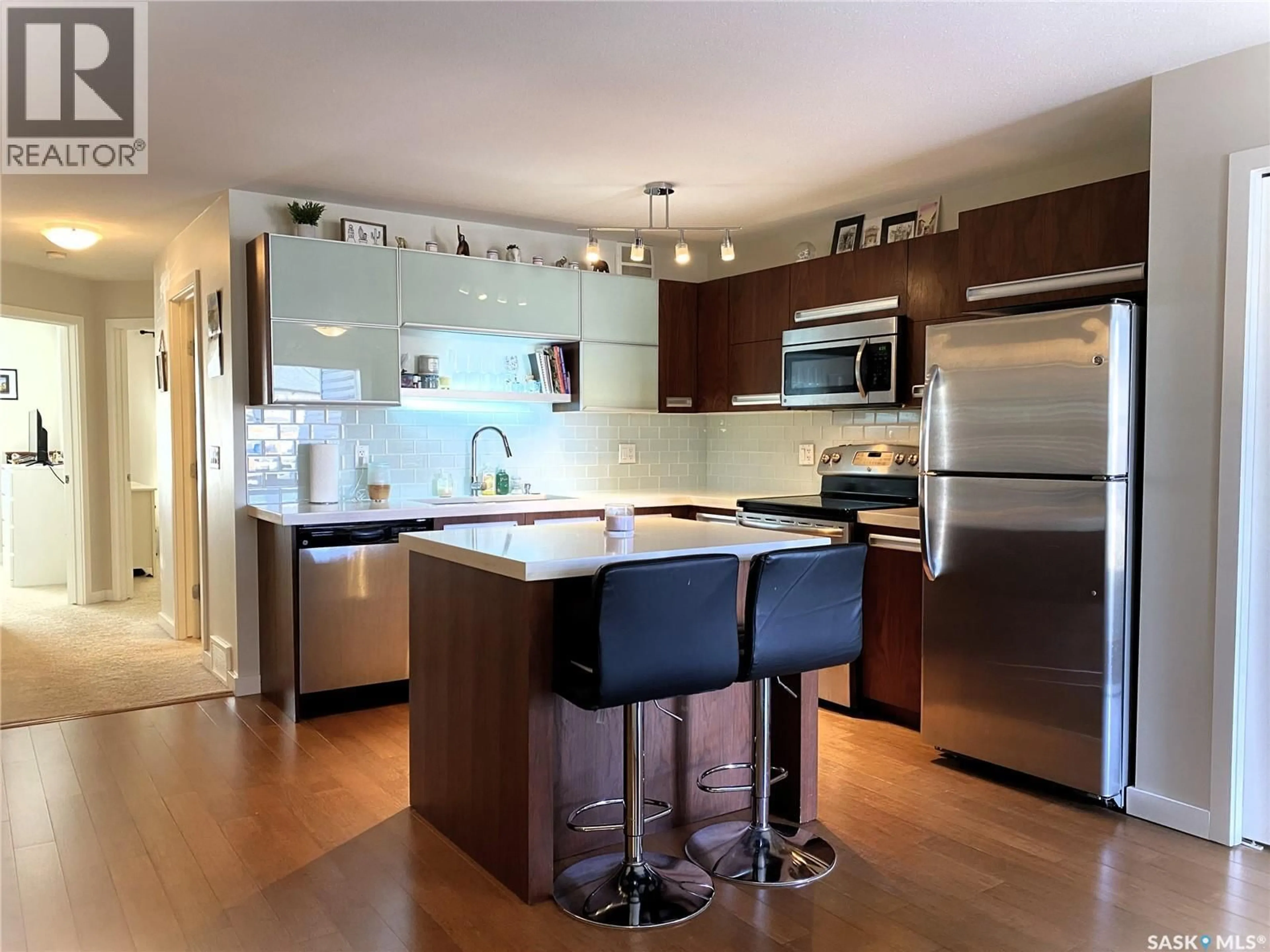 Open concept kitchen, wood/laminate floor for 1015 - 2407 PATRICK CRESCENT, Saskatoon Saskatchewan S7W0M6
