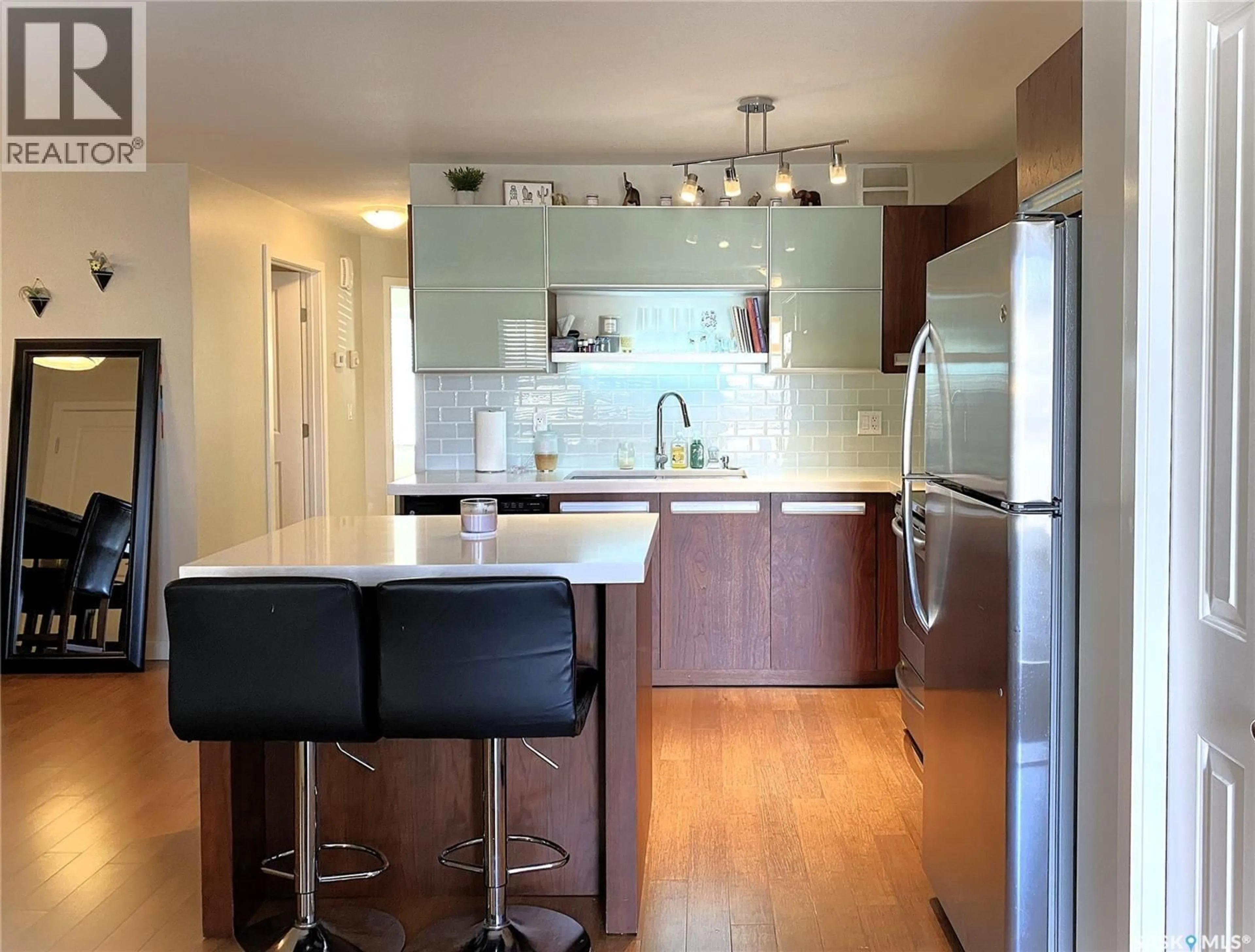 Open concept kitchen, wood/laminate floor for 1015 - 2407 PATRICK CRESCENT, Saskatoon Saskatchewan S7W0M6
