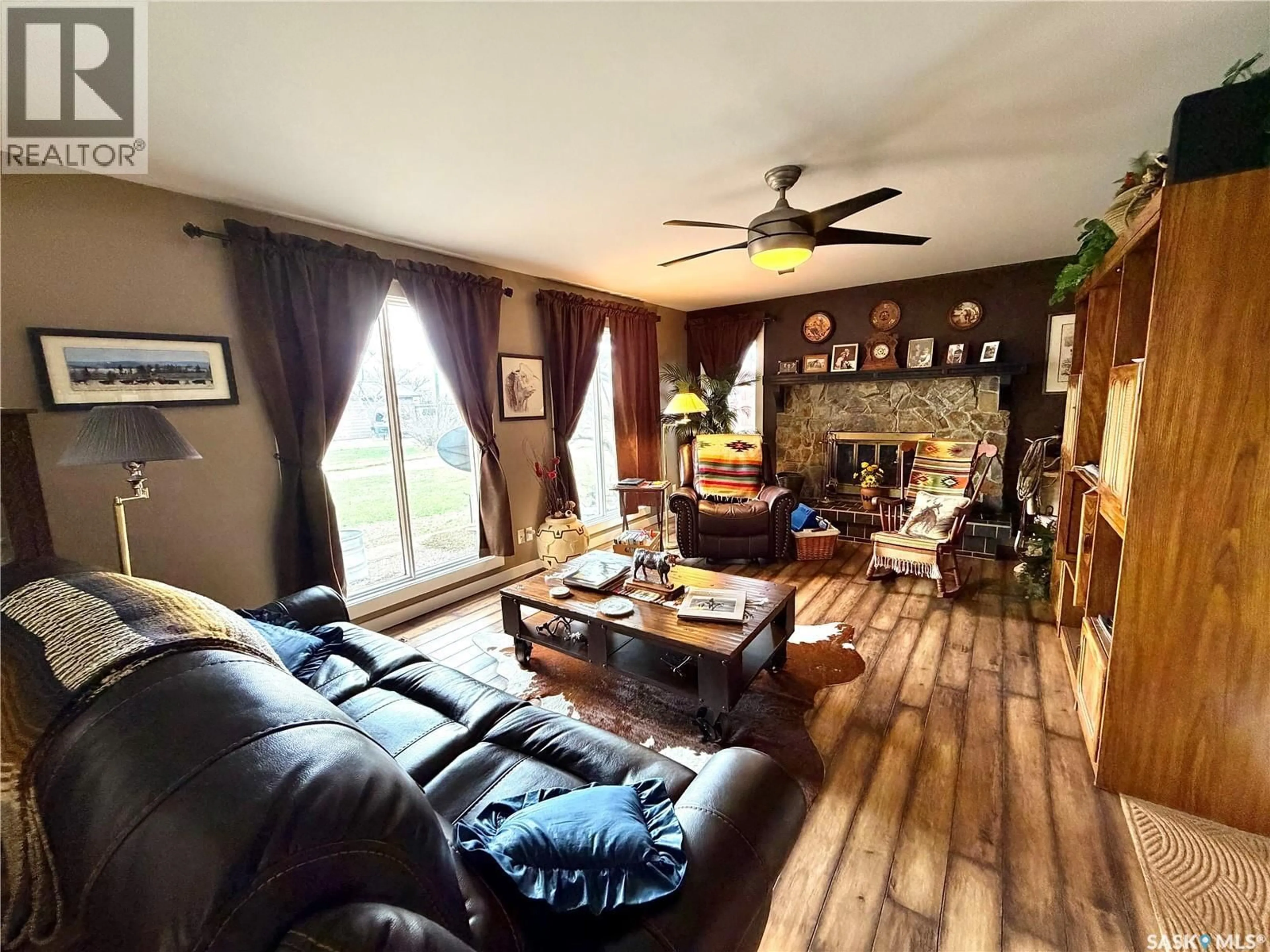 Living room with furniture, wood/laminate floor for ROCKING CHAIR RANCH, Herbert Saskatchewan S0H2A0