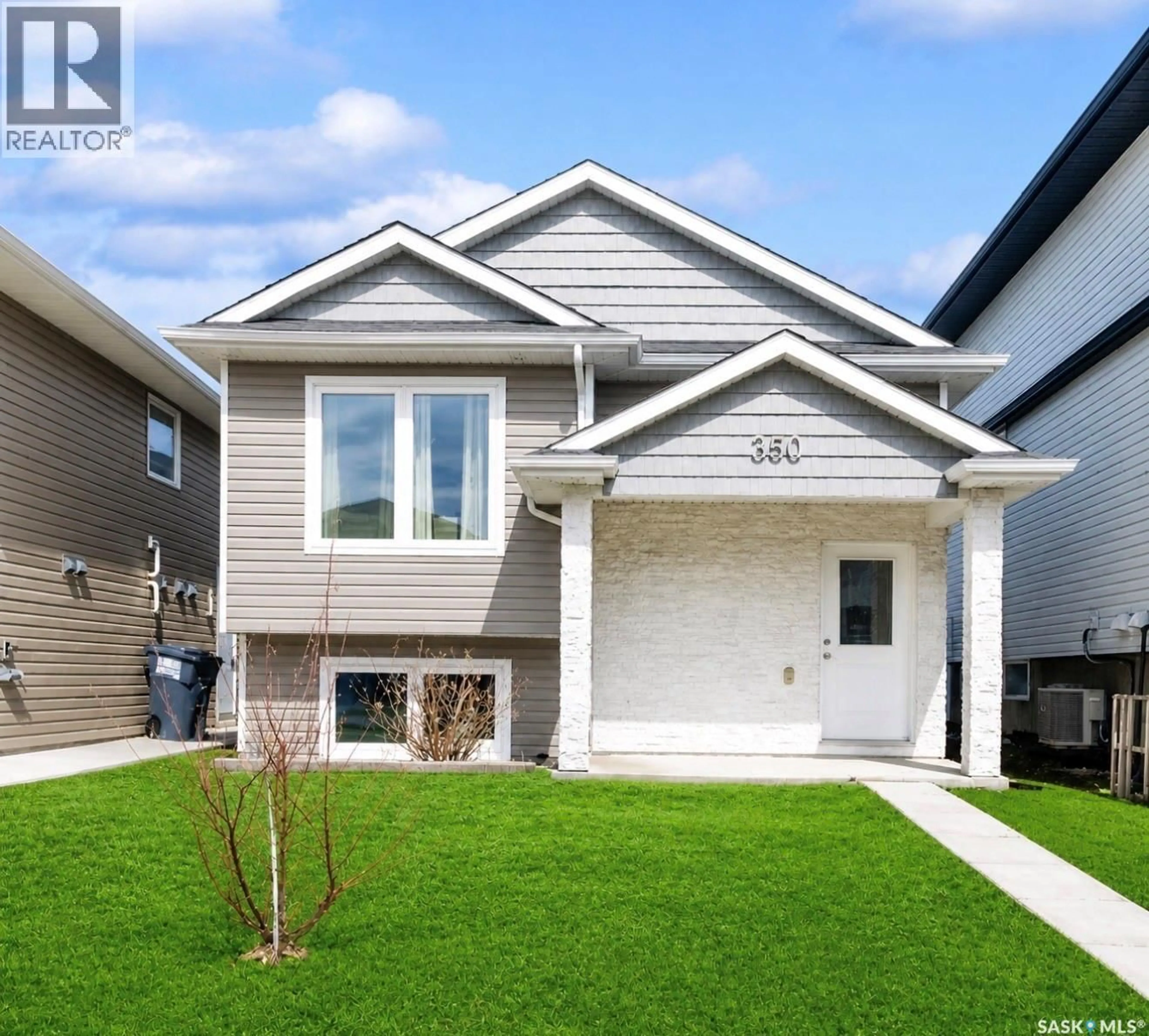 Home with vinyl exterior material, street for 350 MARLATTE STREET, Saskatoon Saskatchewan S7W0S7