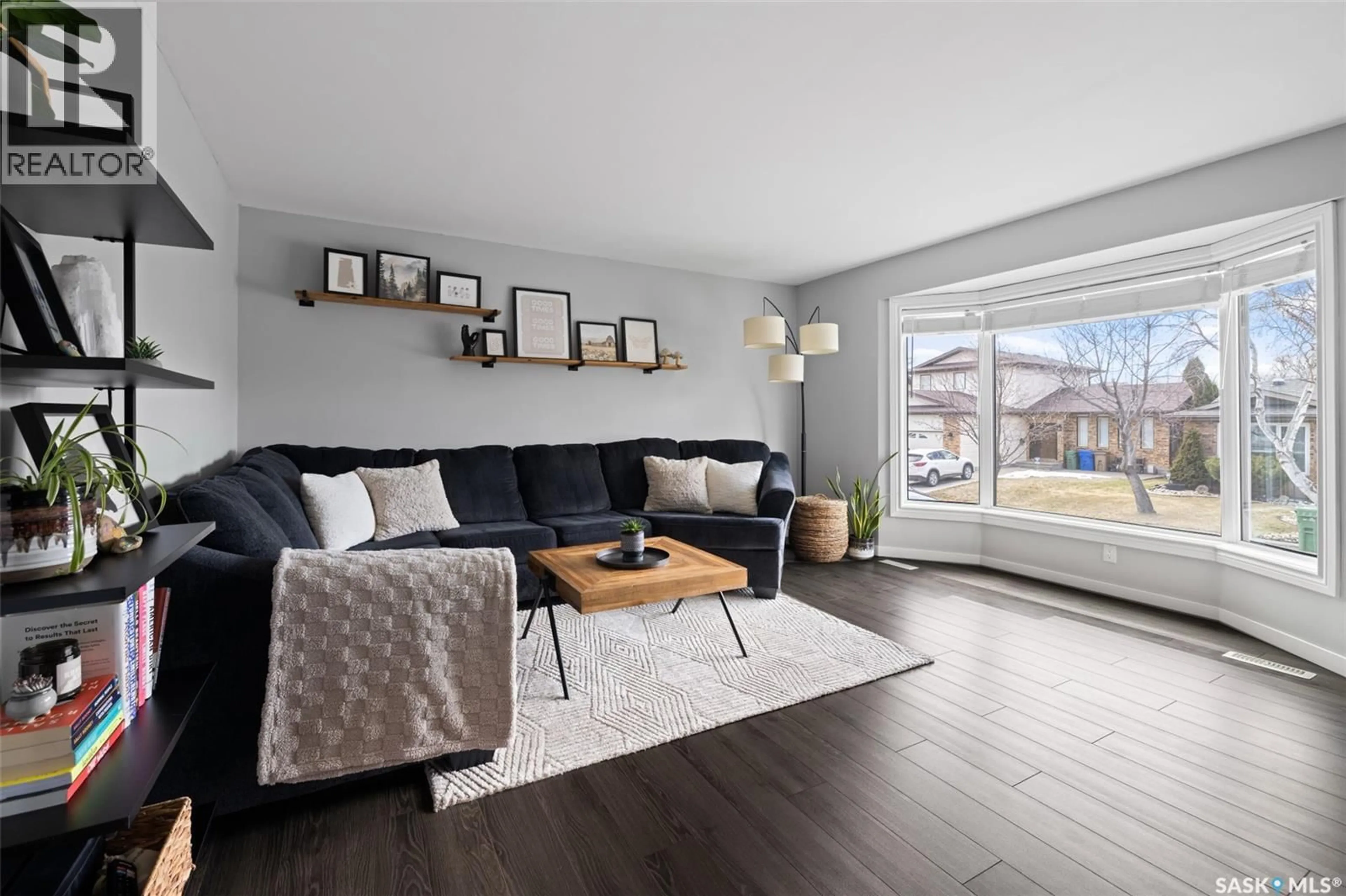 Living room with furniture, wood/laminate floor for 1235 BOURNE STREET, Regina Saskatchewan S4X3C1