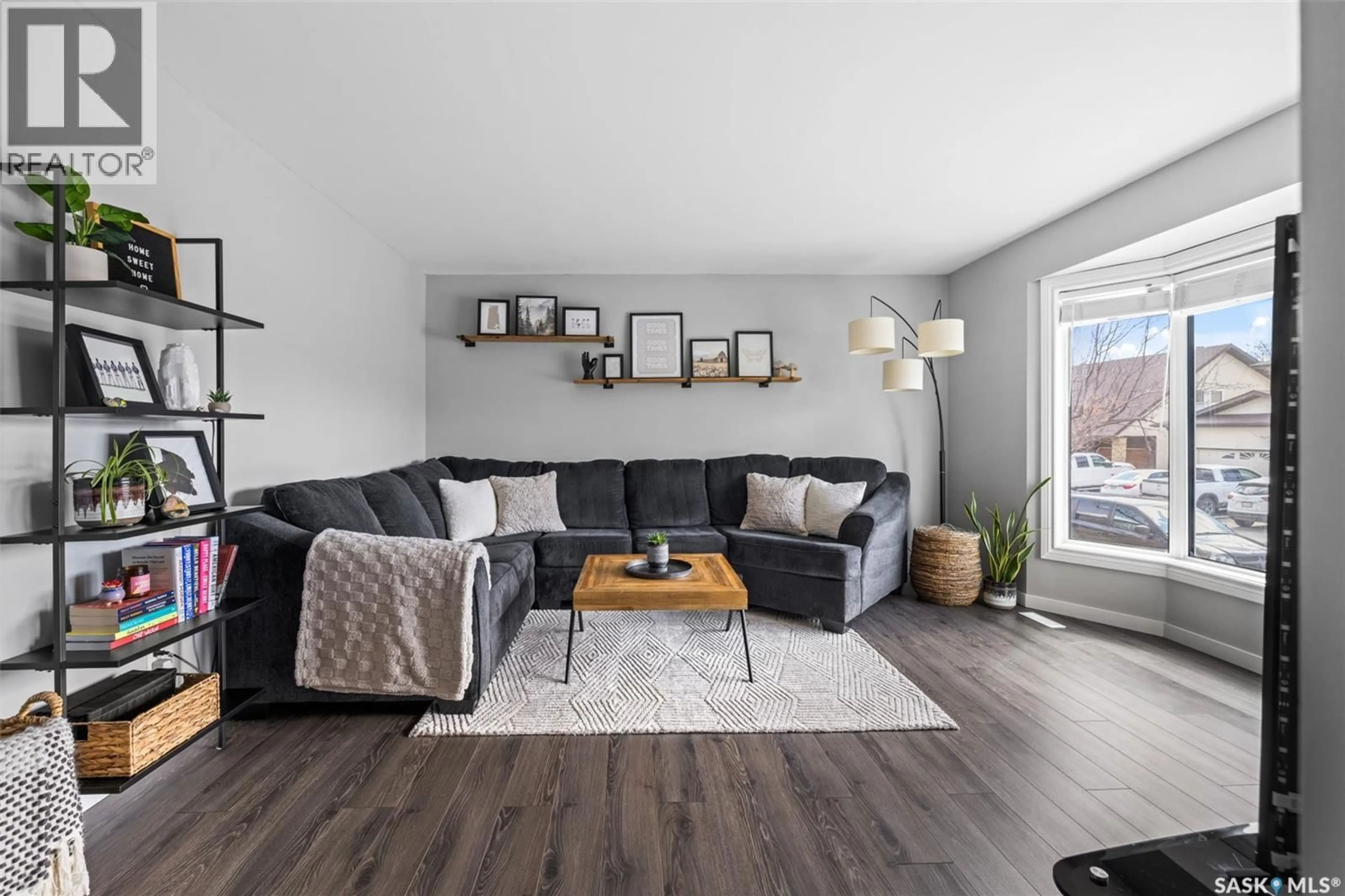 Living room with furniture, wood/laminate floor for 1235 BOURNE STREET, Regina Saskatchewan S4X3C1