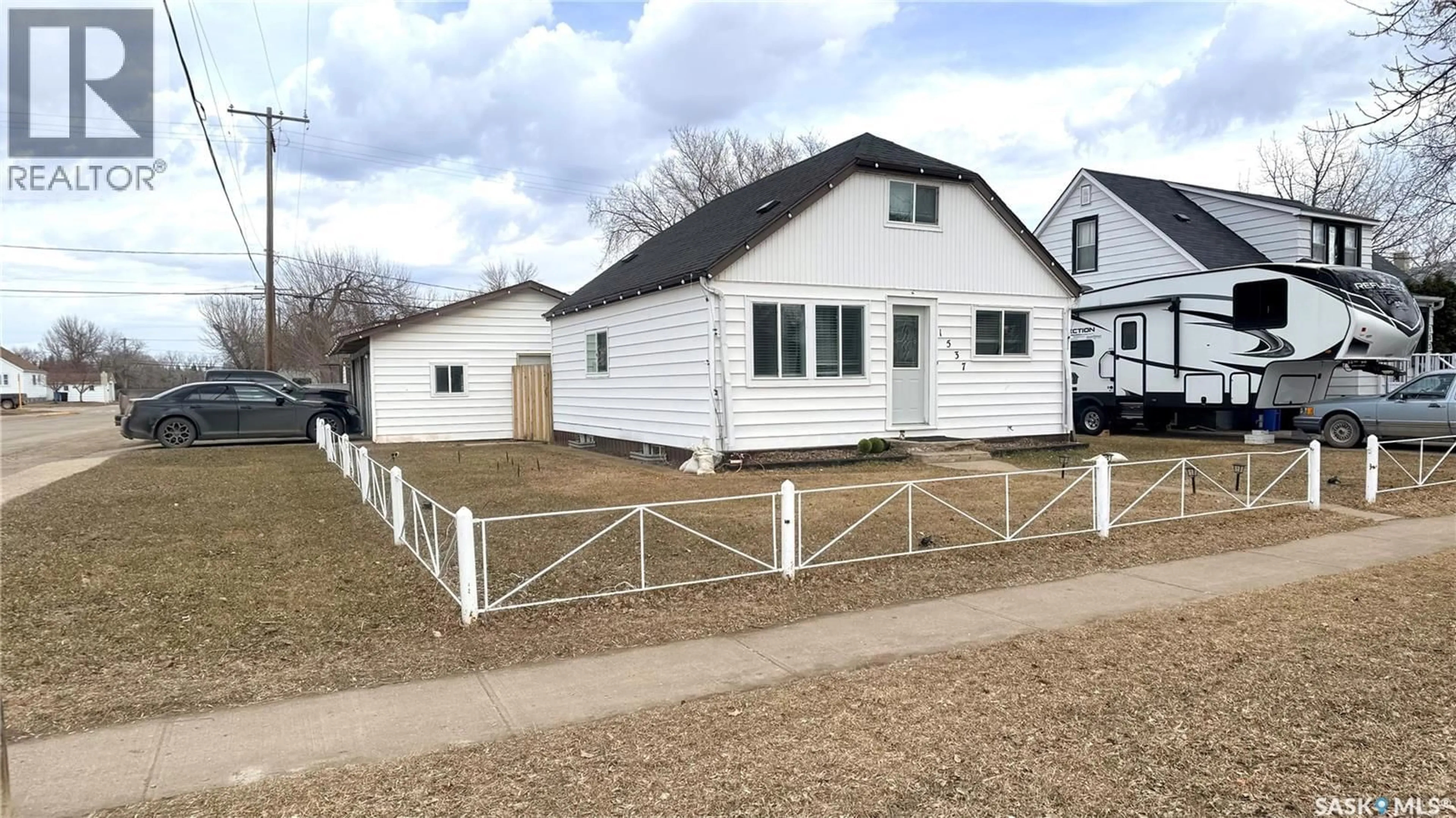 Home with vinyl exterior material, street for 1537 SECOND STREET, Estevan Saskatchewan S4A2M9