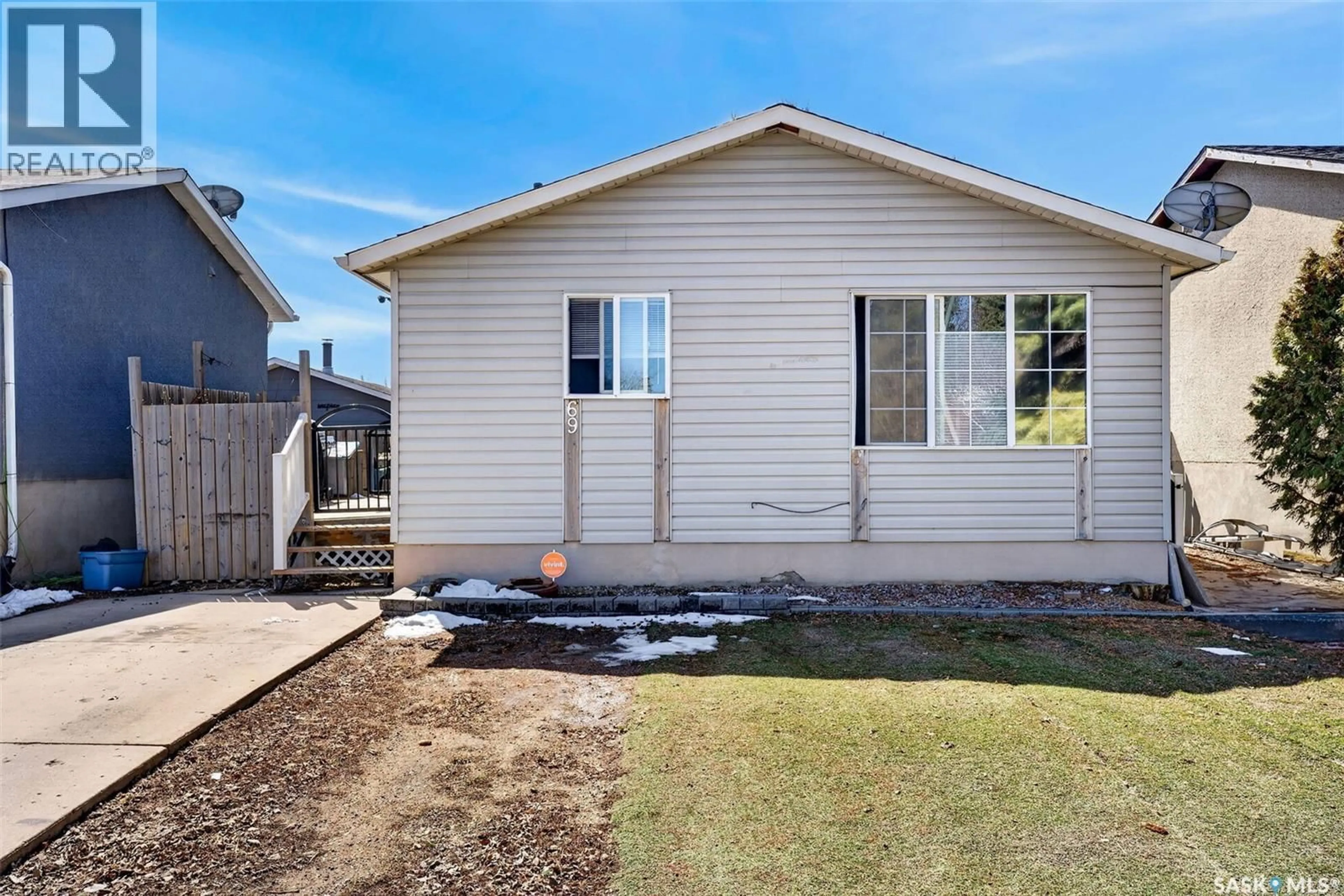 Home with vinyl exterior material, street for 69 MCGEE CRESCENT, Saskatoon Saskatchewan S7L4M6