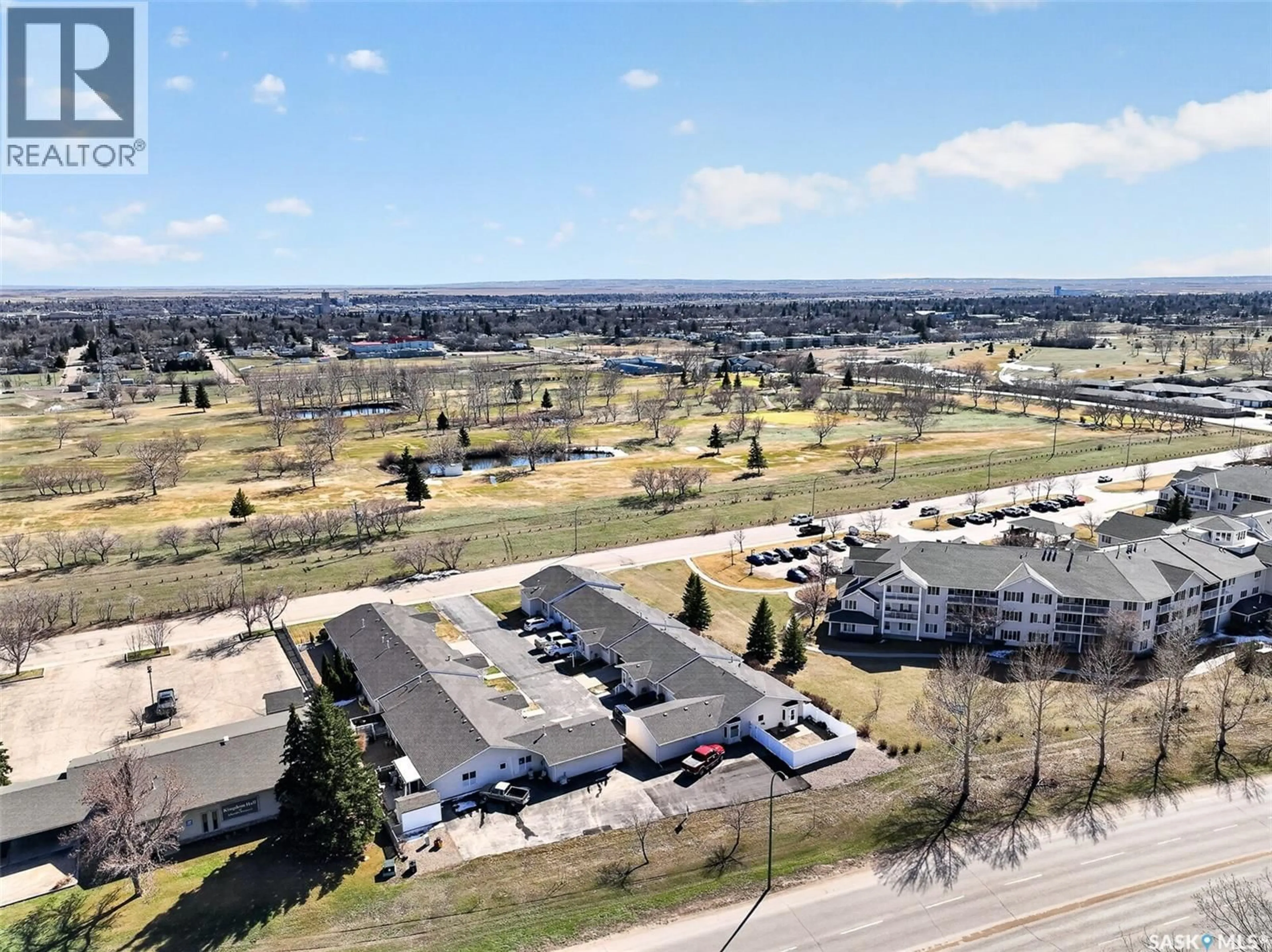 A pic from outside/outdoor area/front of a property/back of a property/a pic from drone, unknown for 5 212 MULBERRY LANE, Moose Jaw Saskatchewan S6J1N4