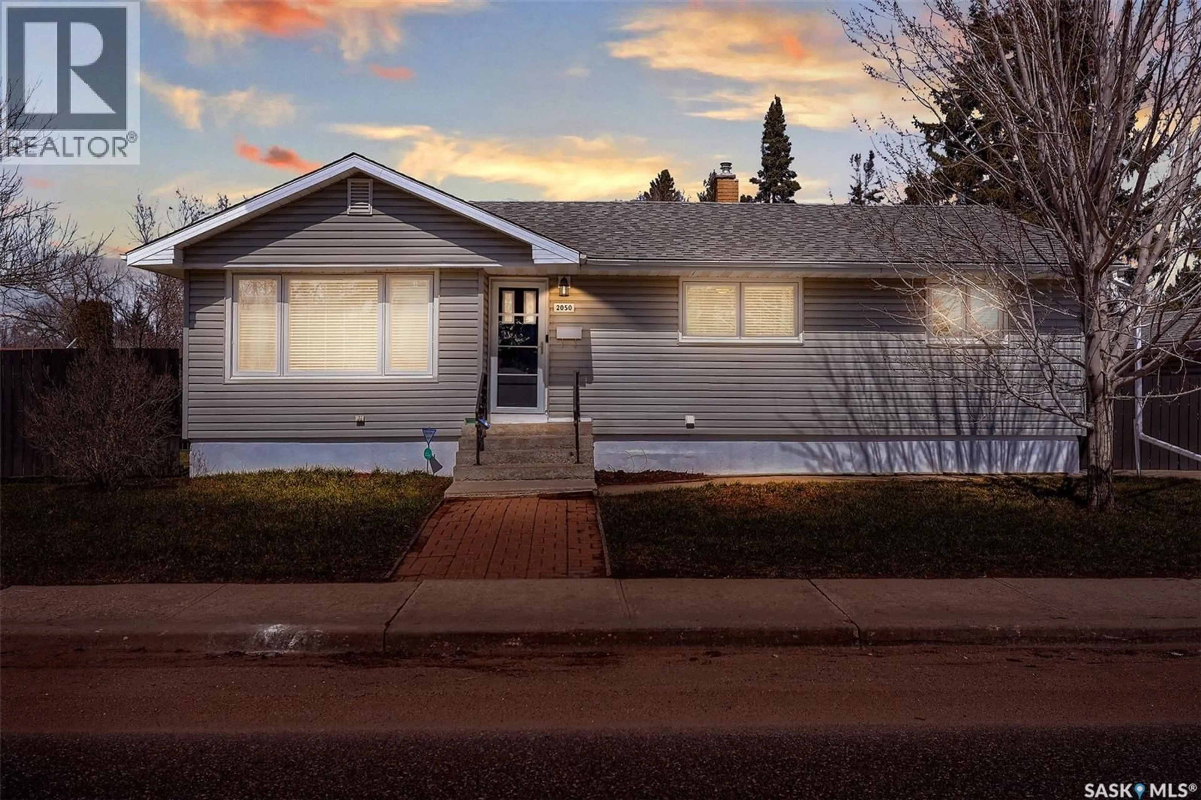 Home with vinyl exterior material, street for 2050 JUBILEE AVENUE, Regina Saskatchewan S4S3T8