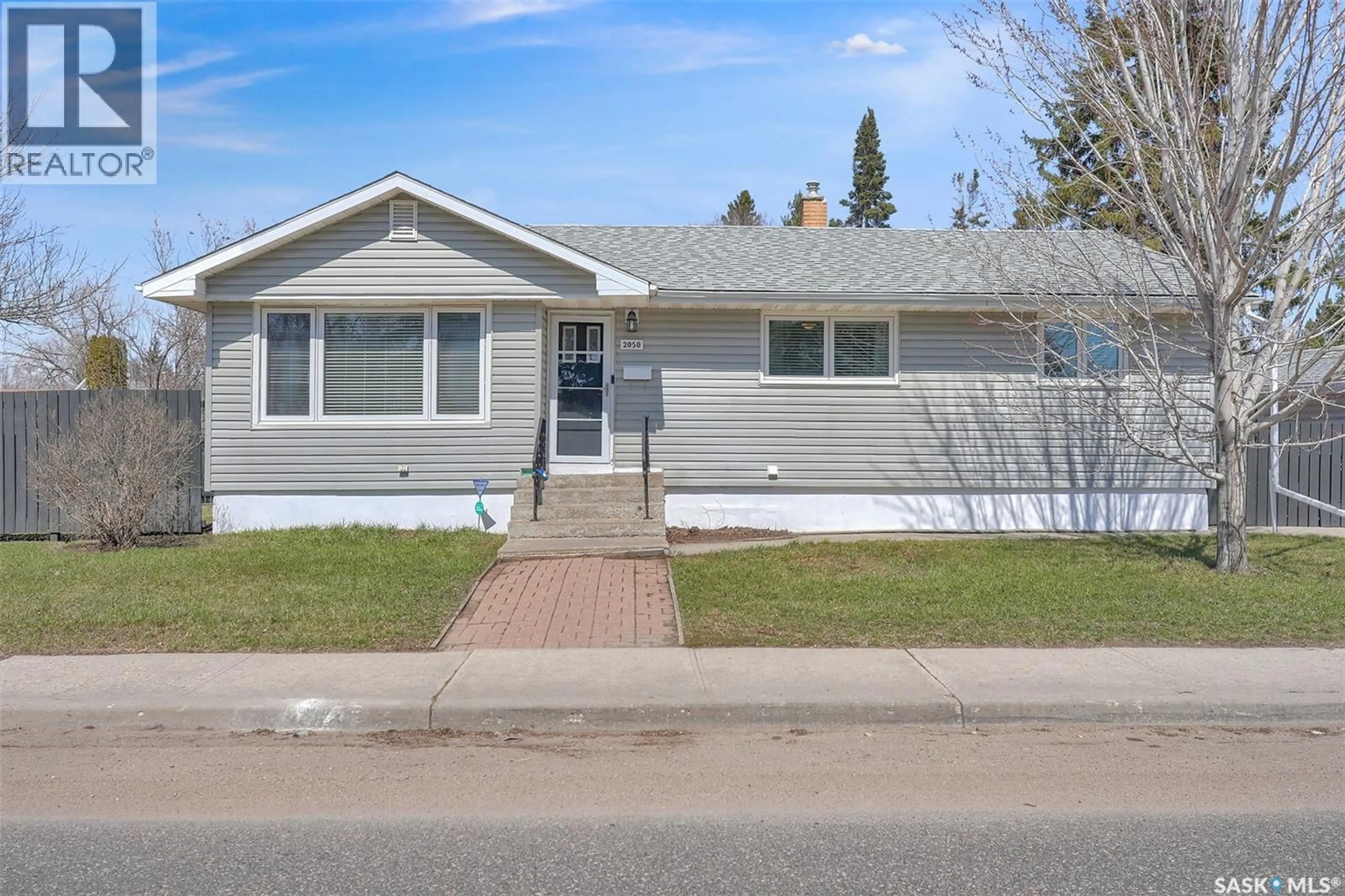 Home with vinyl exterior material, street for 2050 JUBILEE AVENUE, Regina Saskatchewan S4S3T8