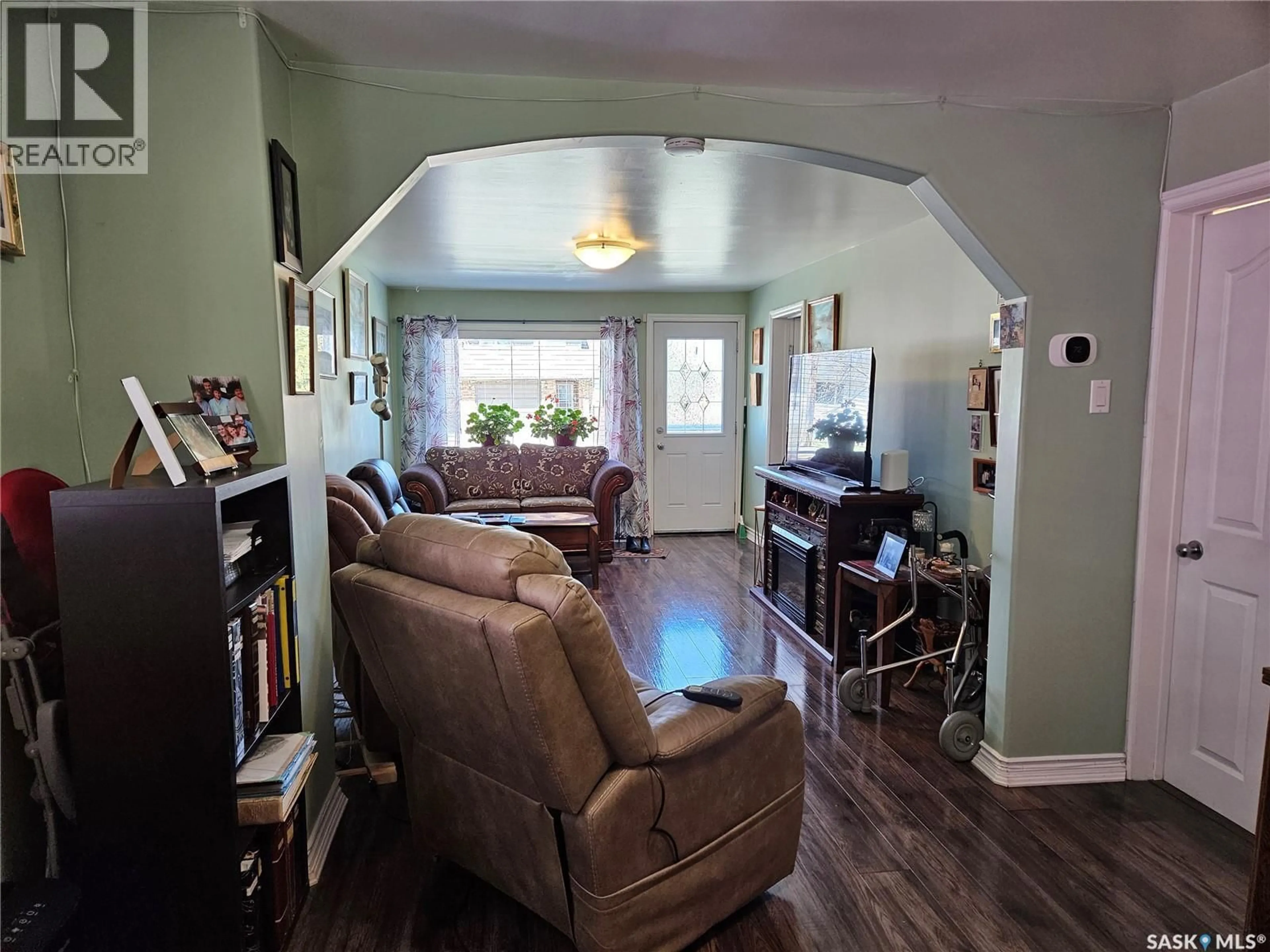 Living room with furniture, wood/laminate floor for 237 DUFFIELD STREET, Moose Jaw Saskatchewan S6H5H2