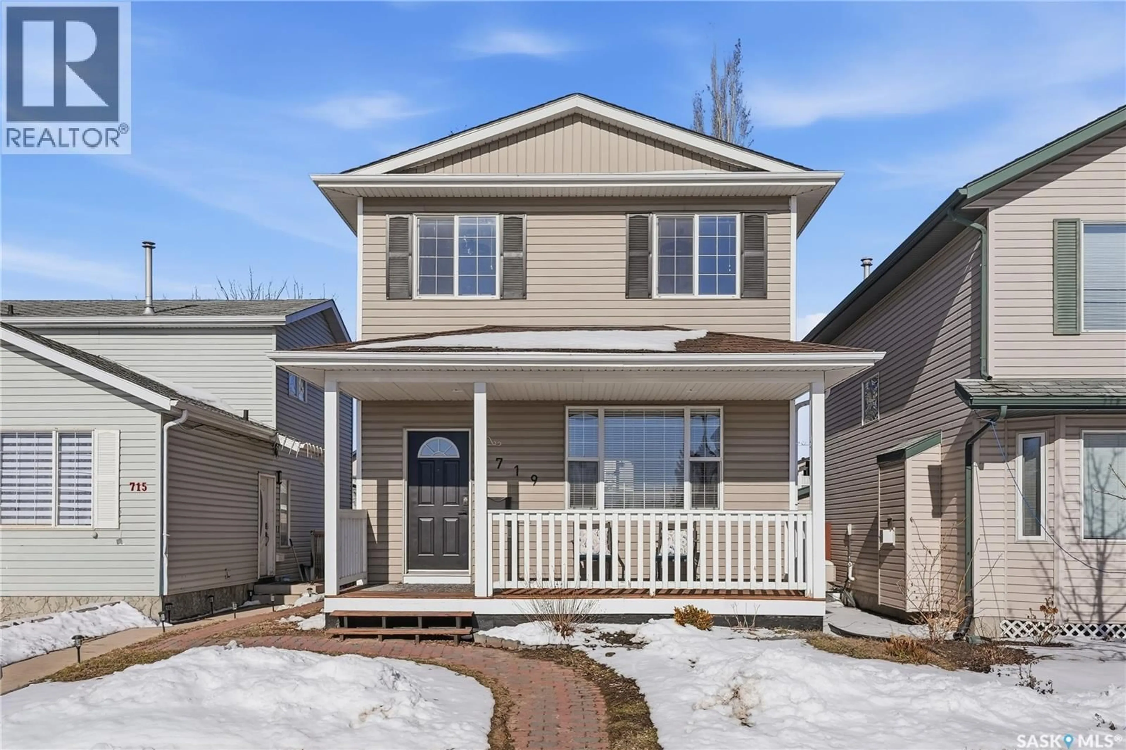 Home with vinyl exterior material, street for 719 RUTHERFORD LANE, Saskatoon Saskatchewan S7N4X8