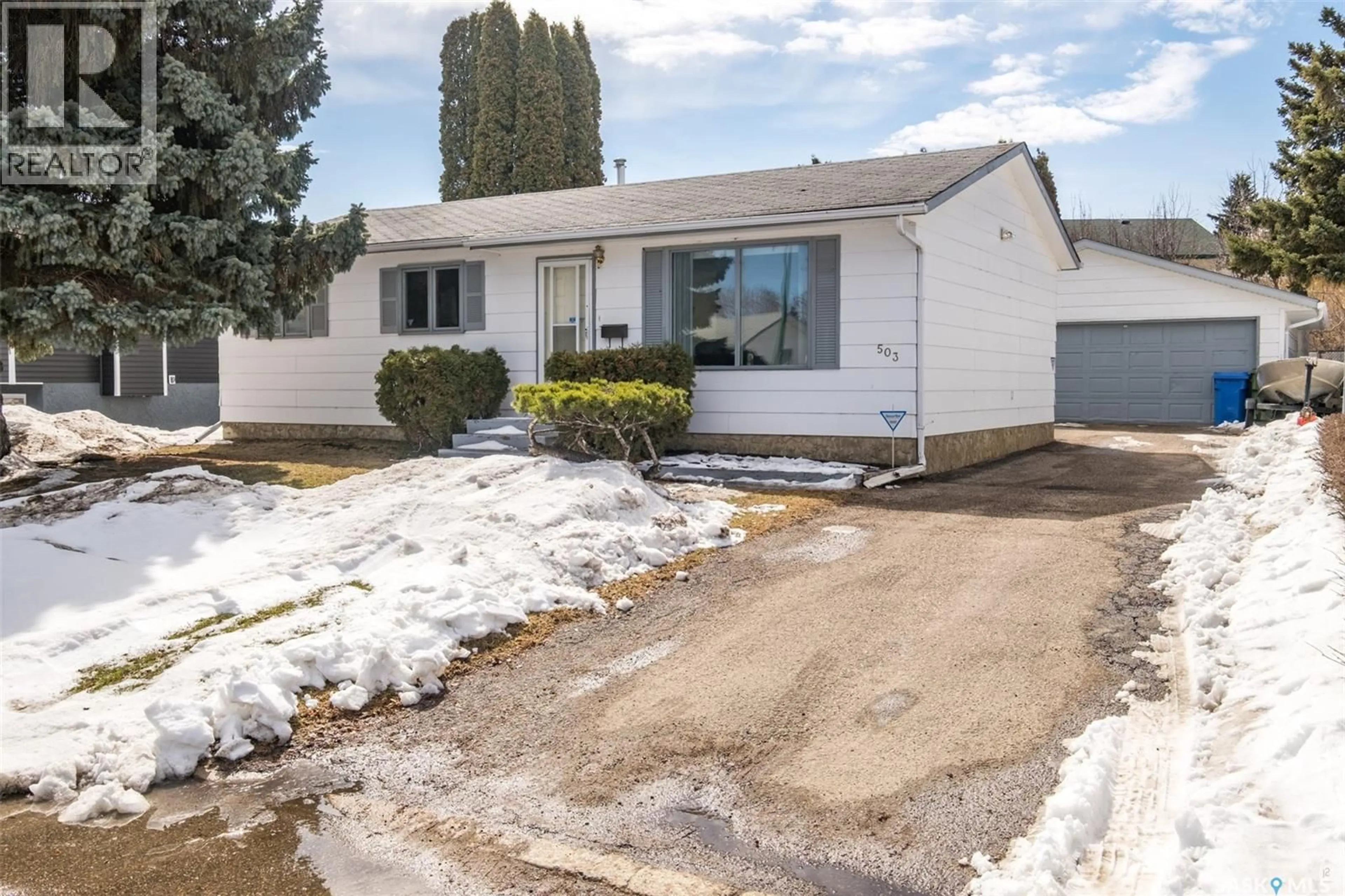 Home with vinyl exterior material, street for 503 BENNETT DRIVE, Prince Albert Saskatchewan S6V6H5