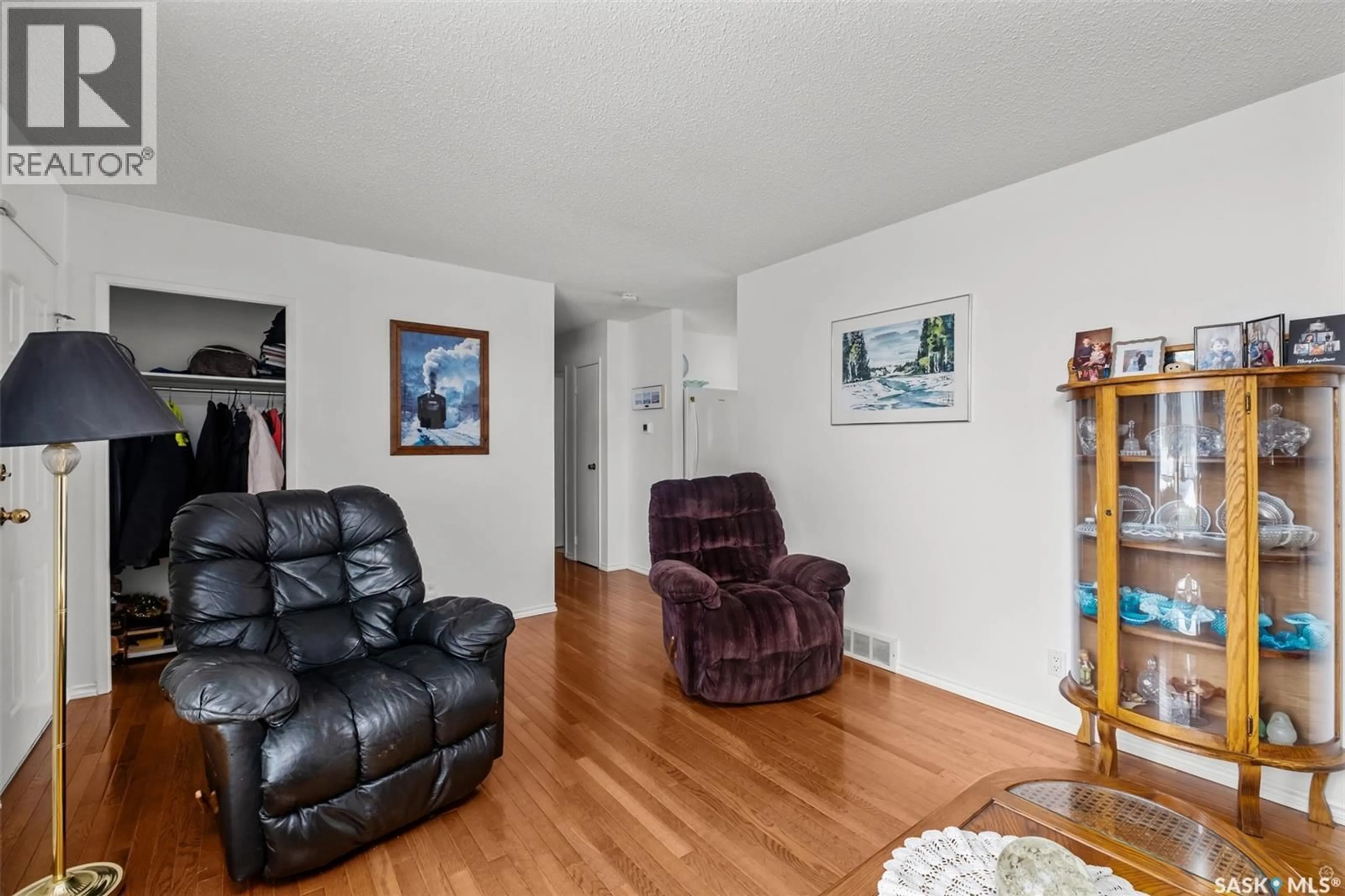 Living room with furniture, wood/laminate floor for 503 BENNETT DRIVE, Prince Albert Saskatchewan S6V6H5