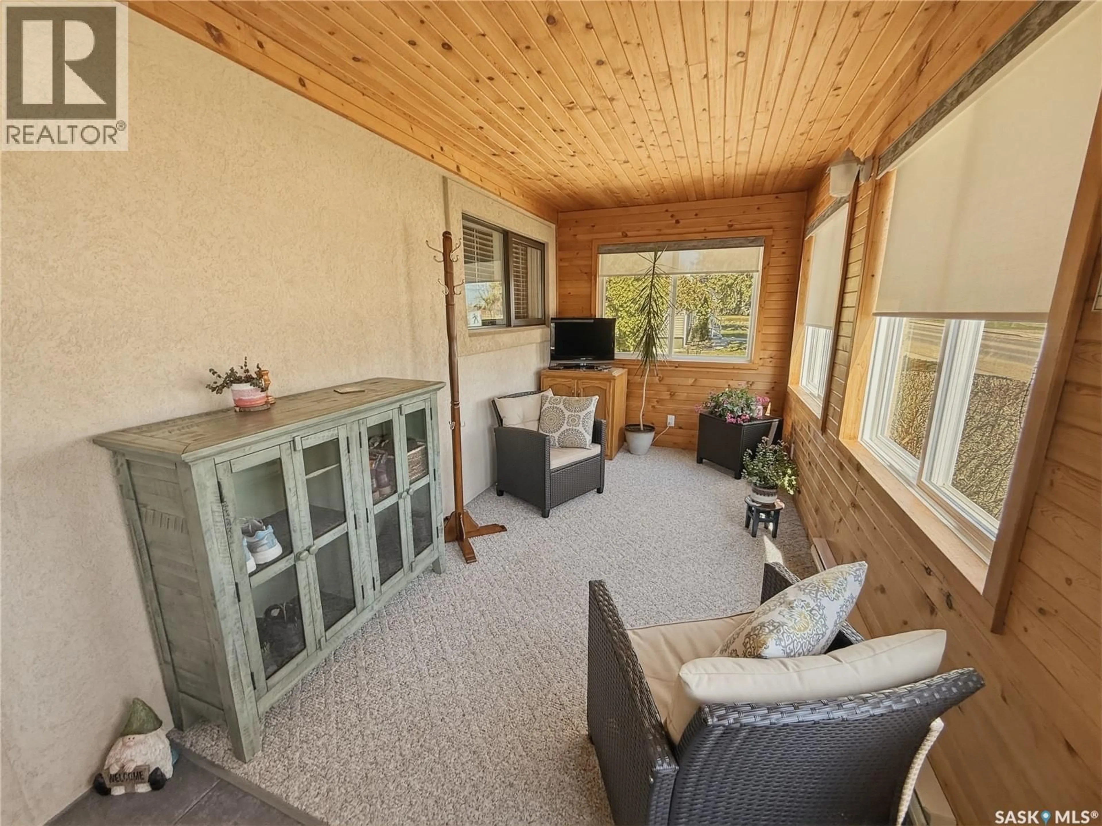 Living room with furniture, wood/laminate floor for 730 6TH AVENUE, Swift Current Saskatchewan S9H2M8