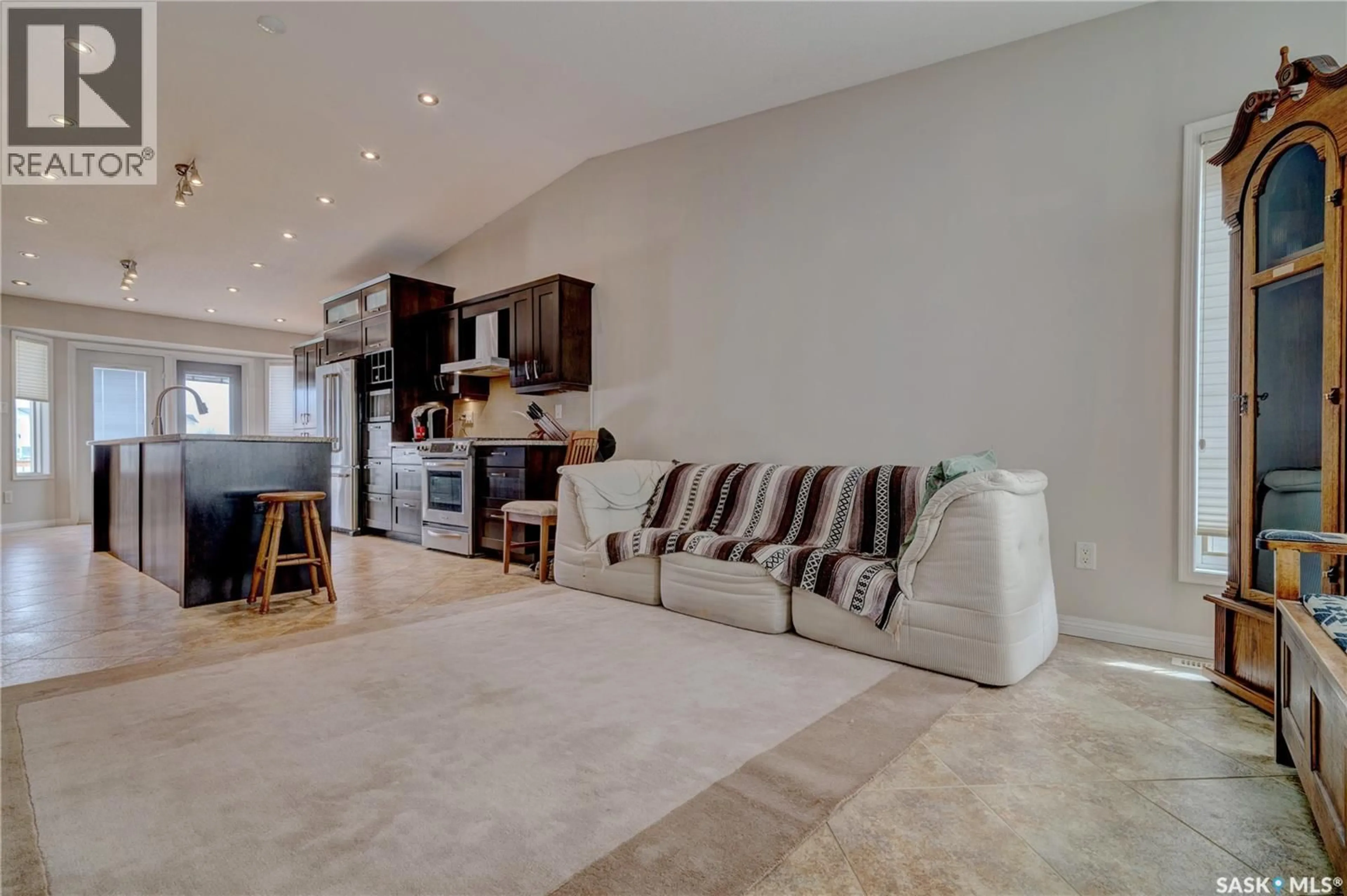 Living room with furniture, ceramic/tile floor for 6343 HIRD CRESCENT, Regina Saskatchewan S4X4G8